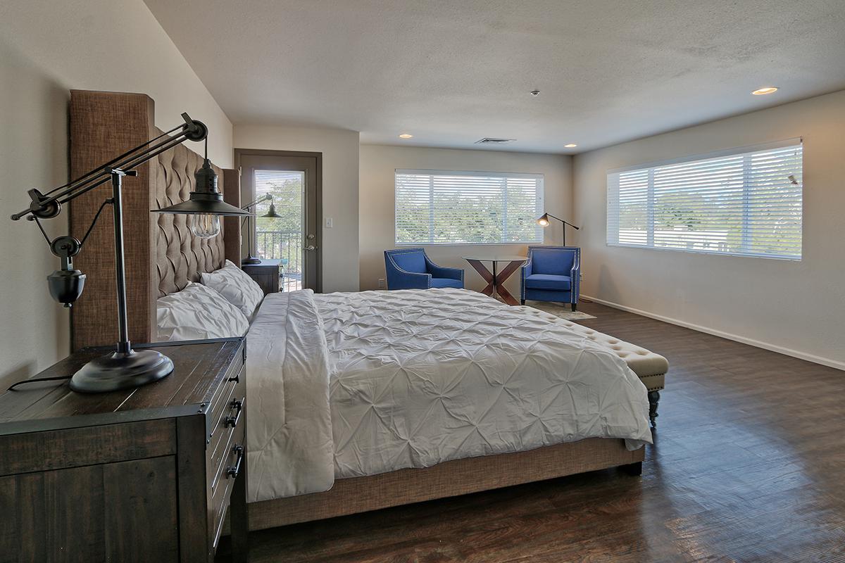 a bedroom with a large bed in a room