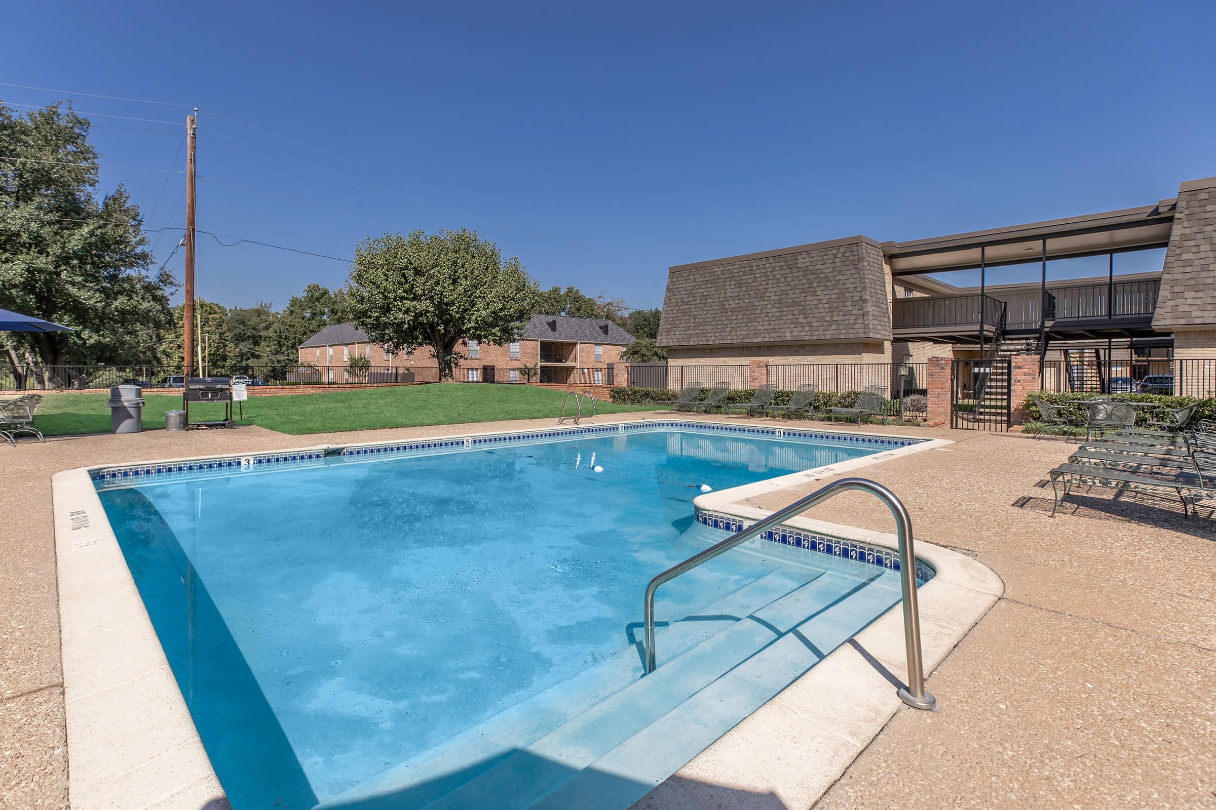 a pool next to a building