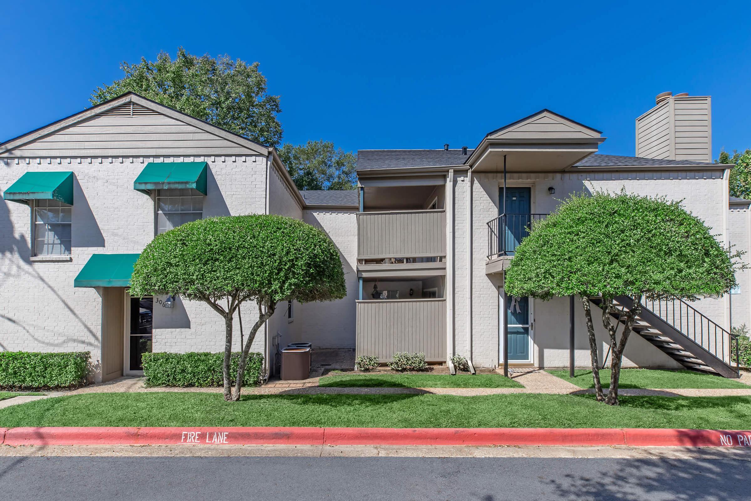 a house with trees in the background