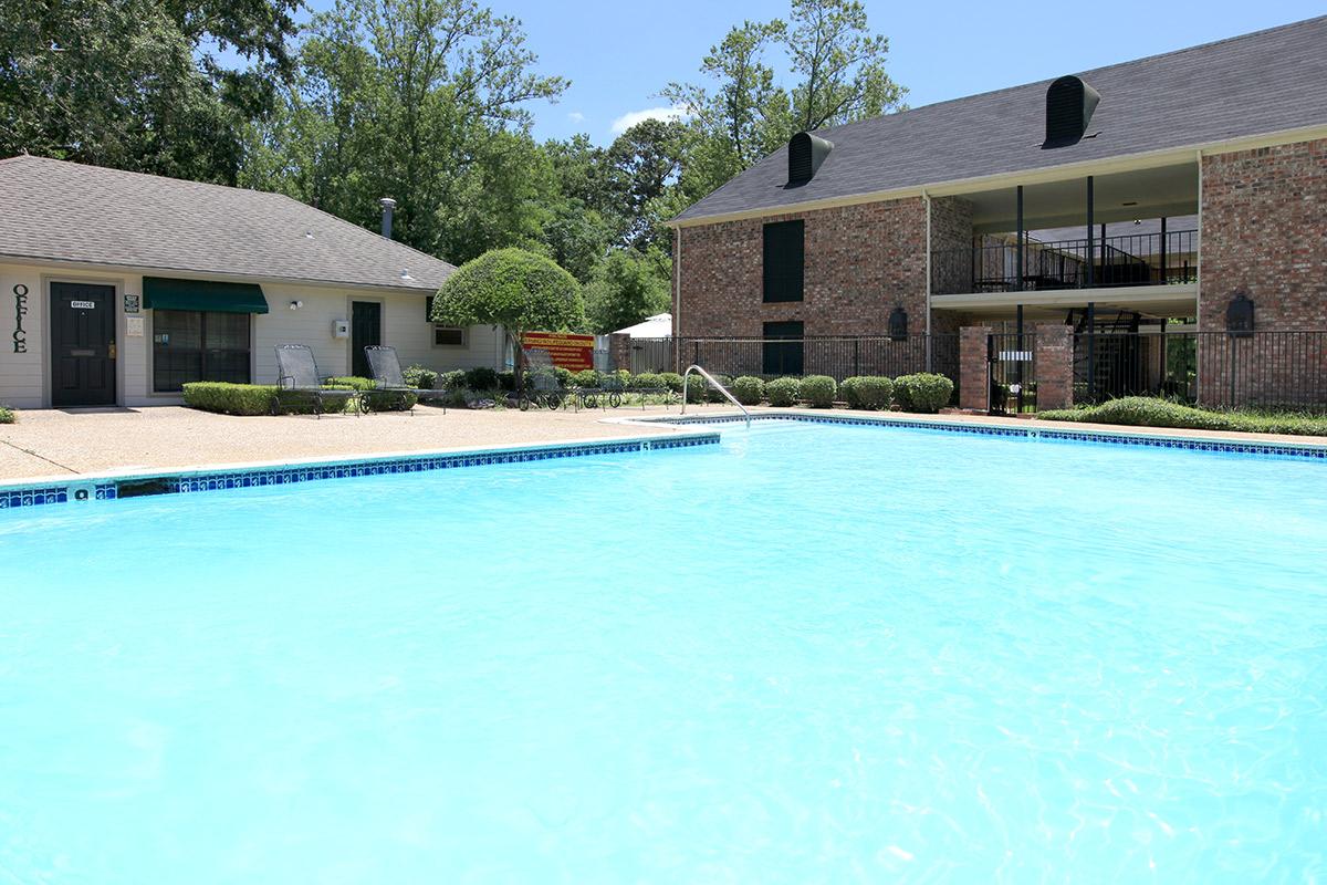 a house with a large pool of water