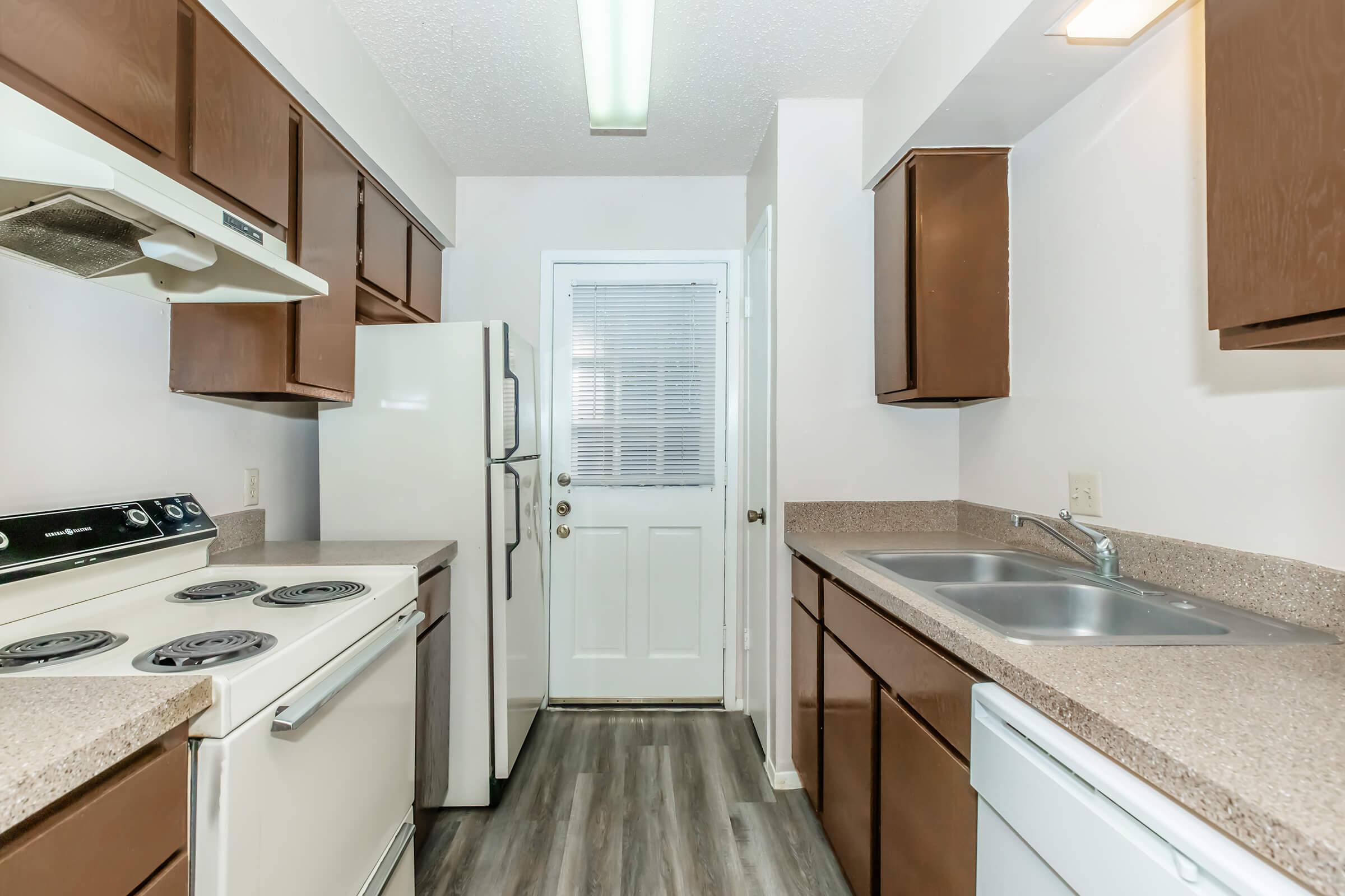 a kitchen with a stove and a sink