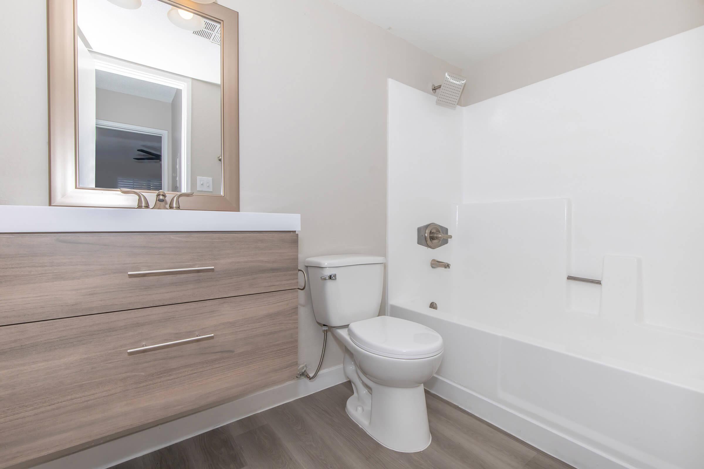 a room with a sink and a mirror