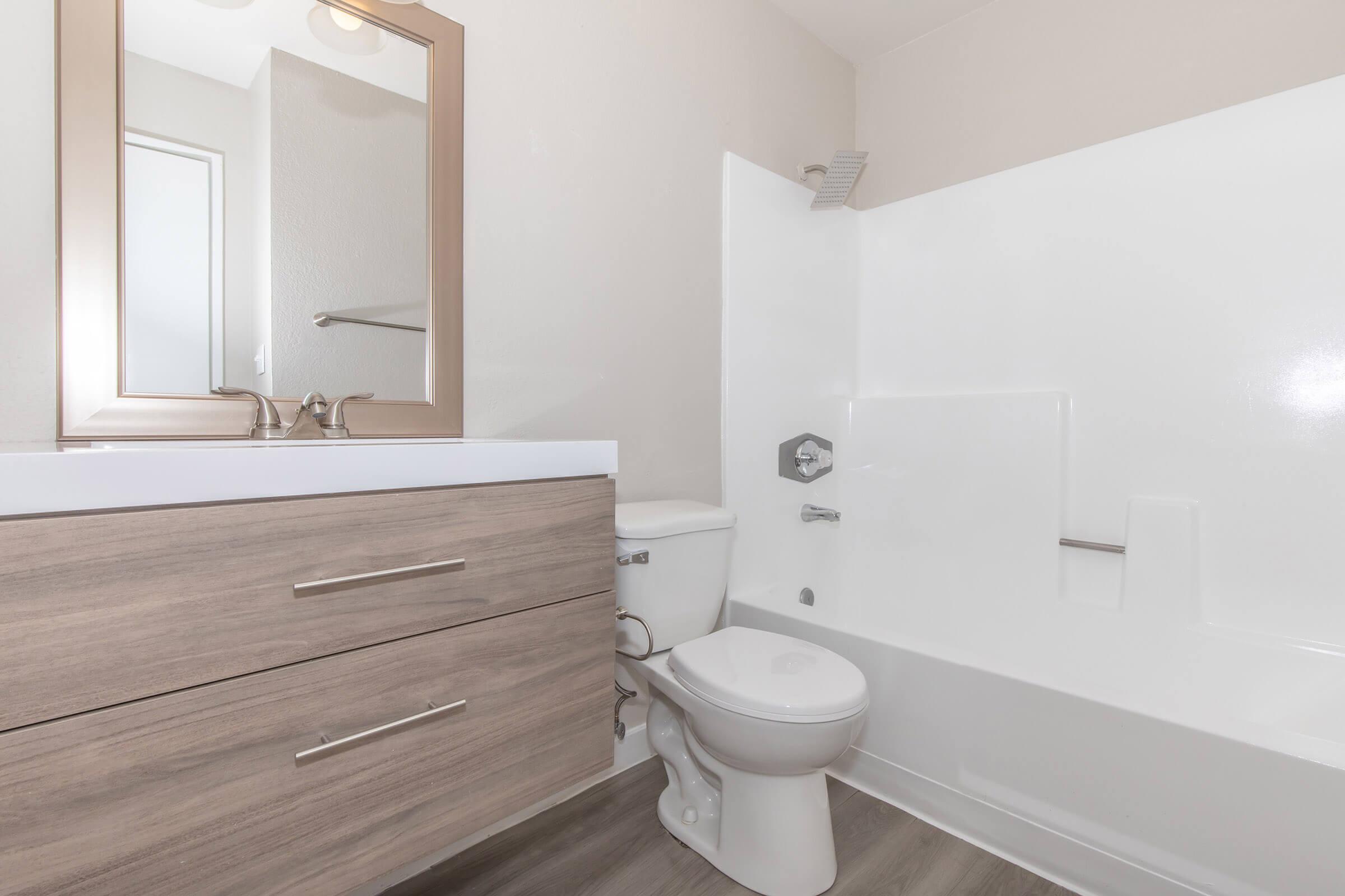 a room with a sink and a mirror