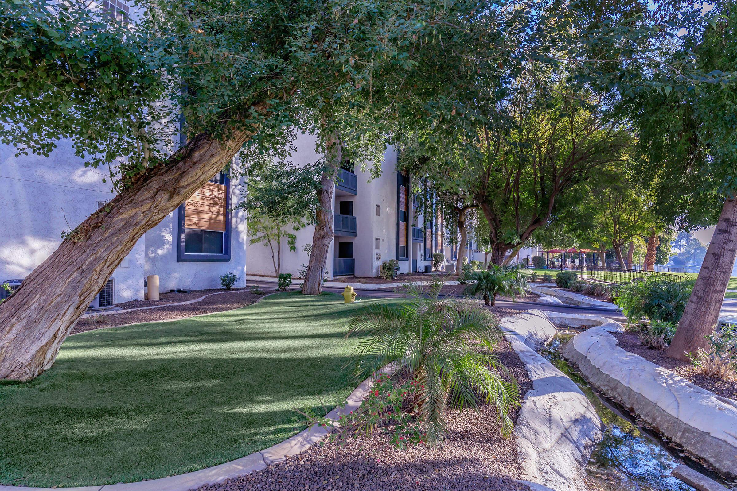 a tree in front of a house