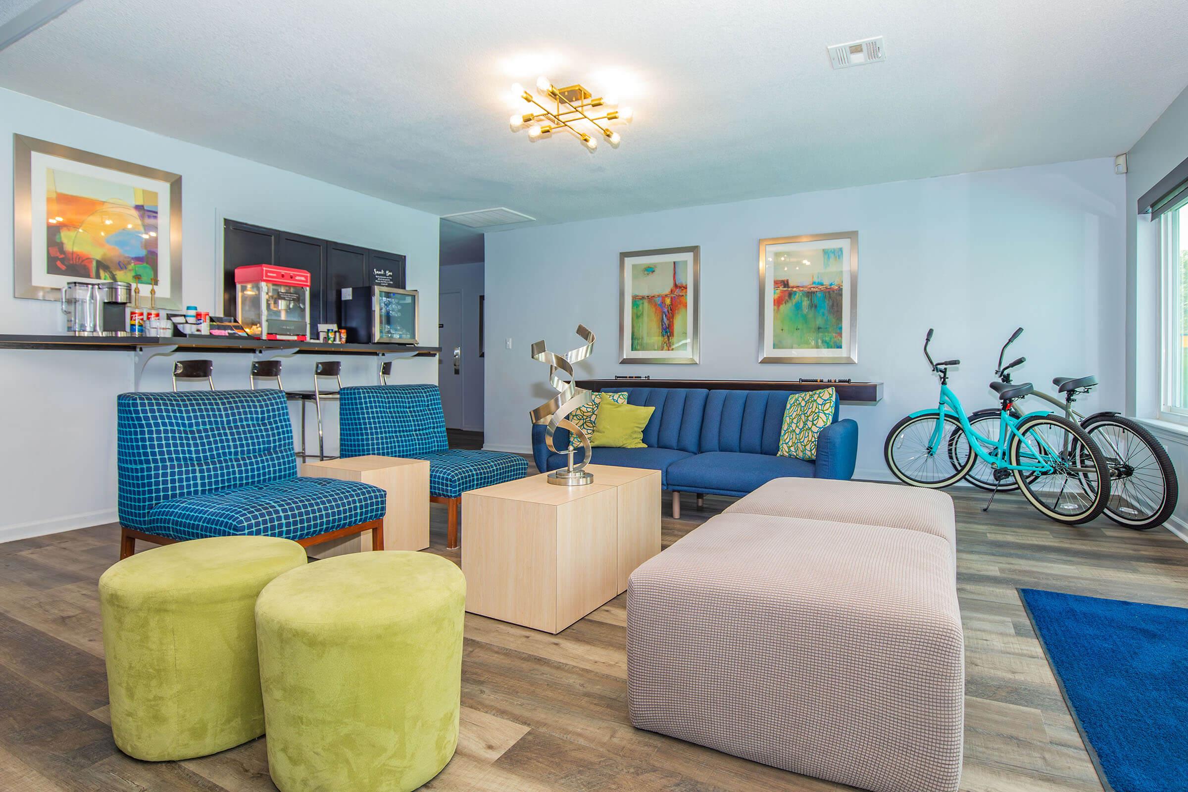 a living room filled with furniture and a blue chair