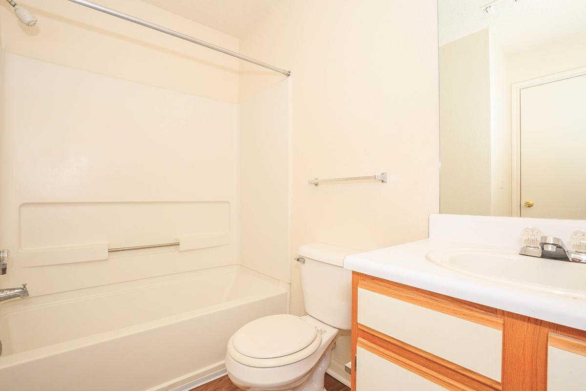 a room with a sink and a mirror