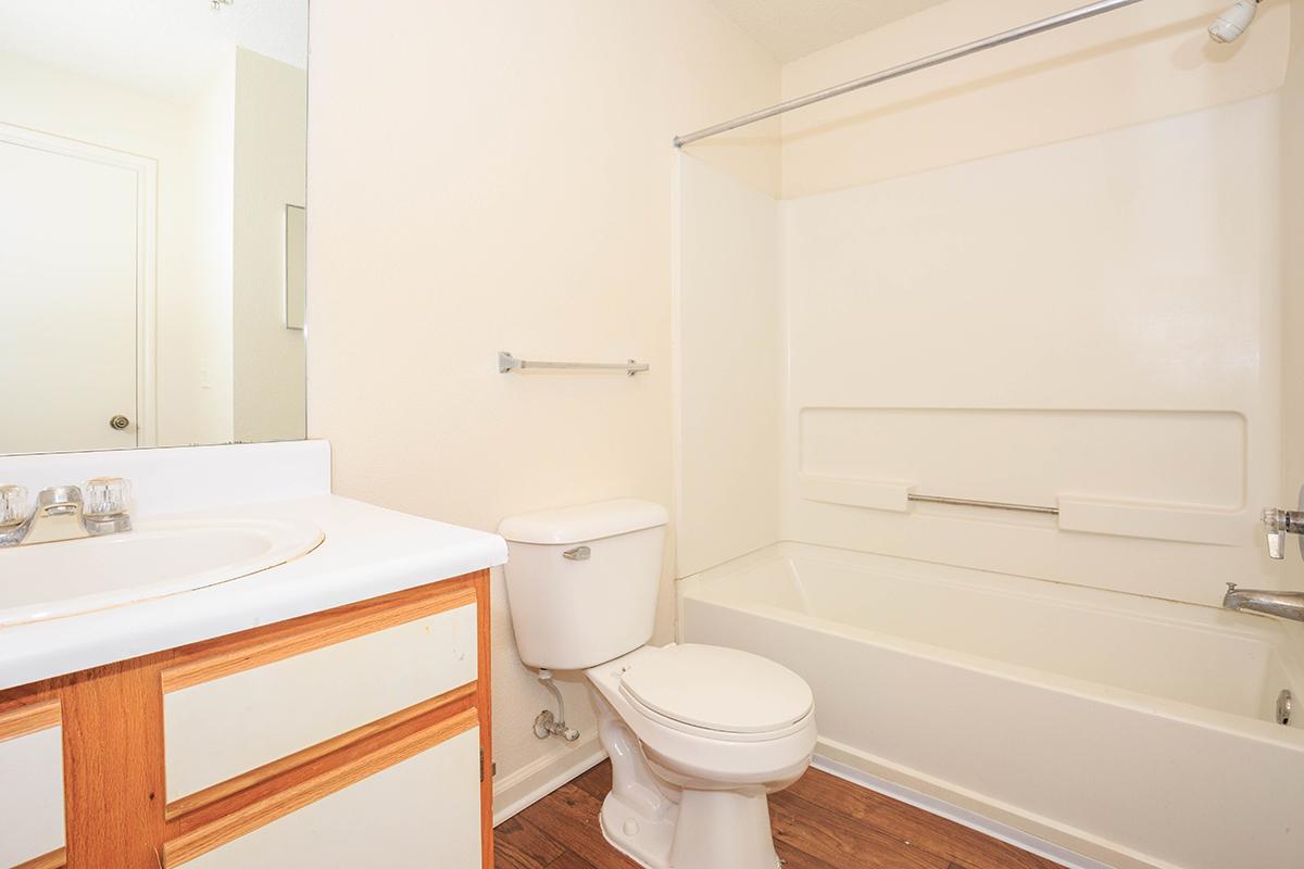 a room with a sink and a mirror