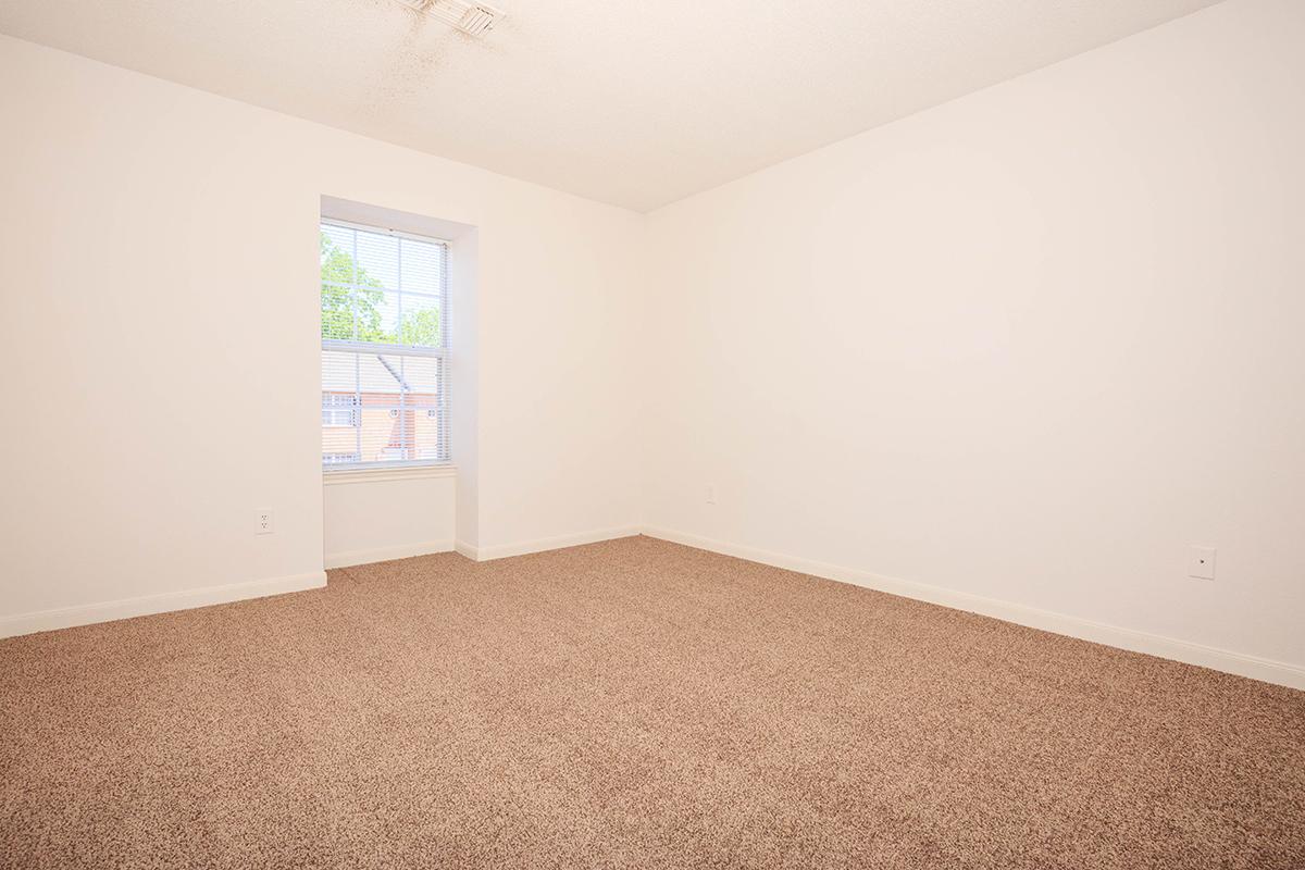 a bedroom with a bed in a room