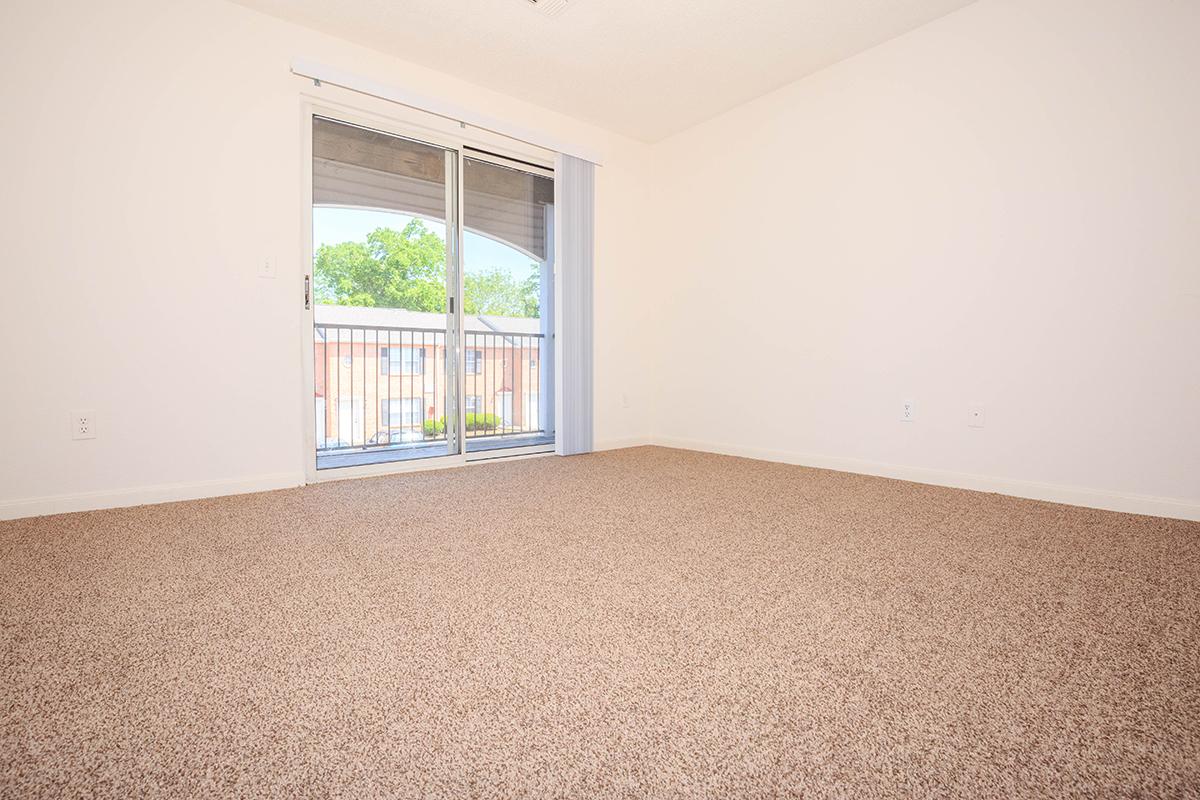 an empty bed in a room