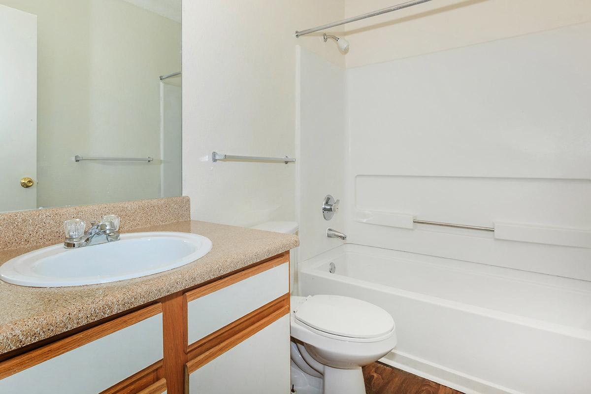 a room with a sink and a mirror