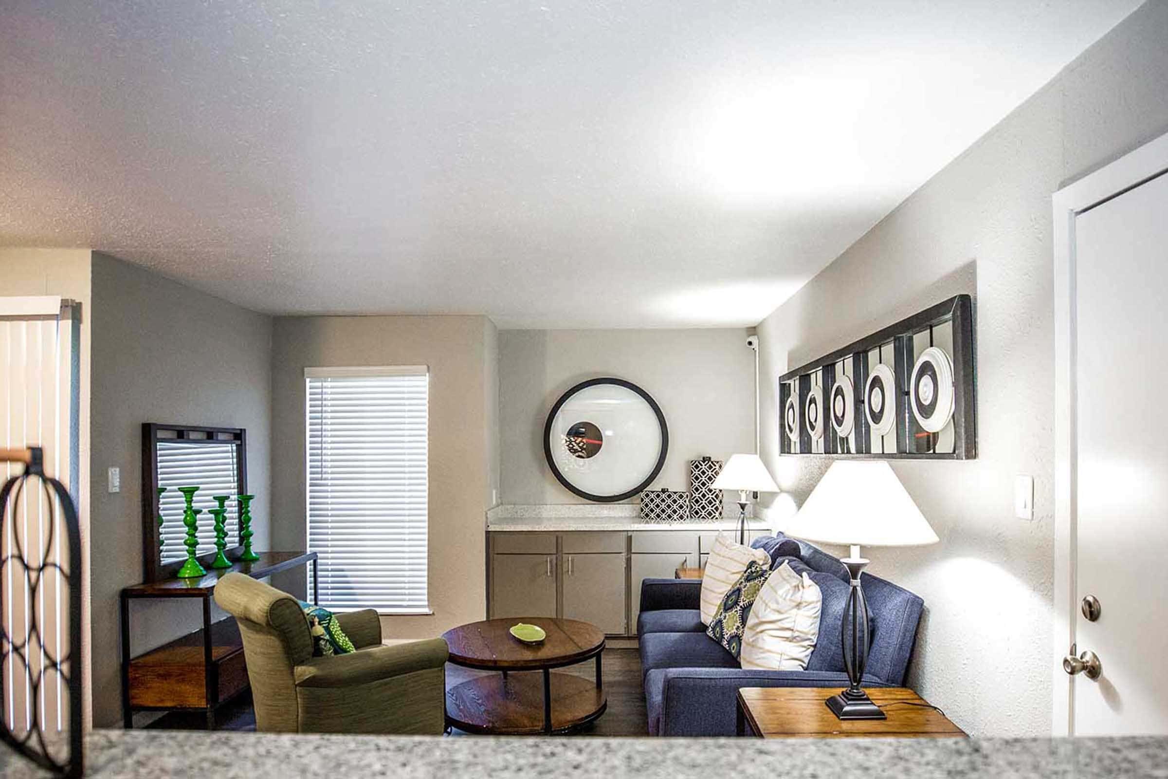 a living room filled with furniture and a fire place