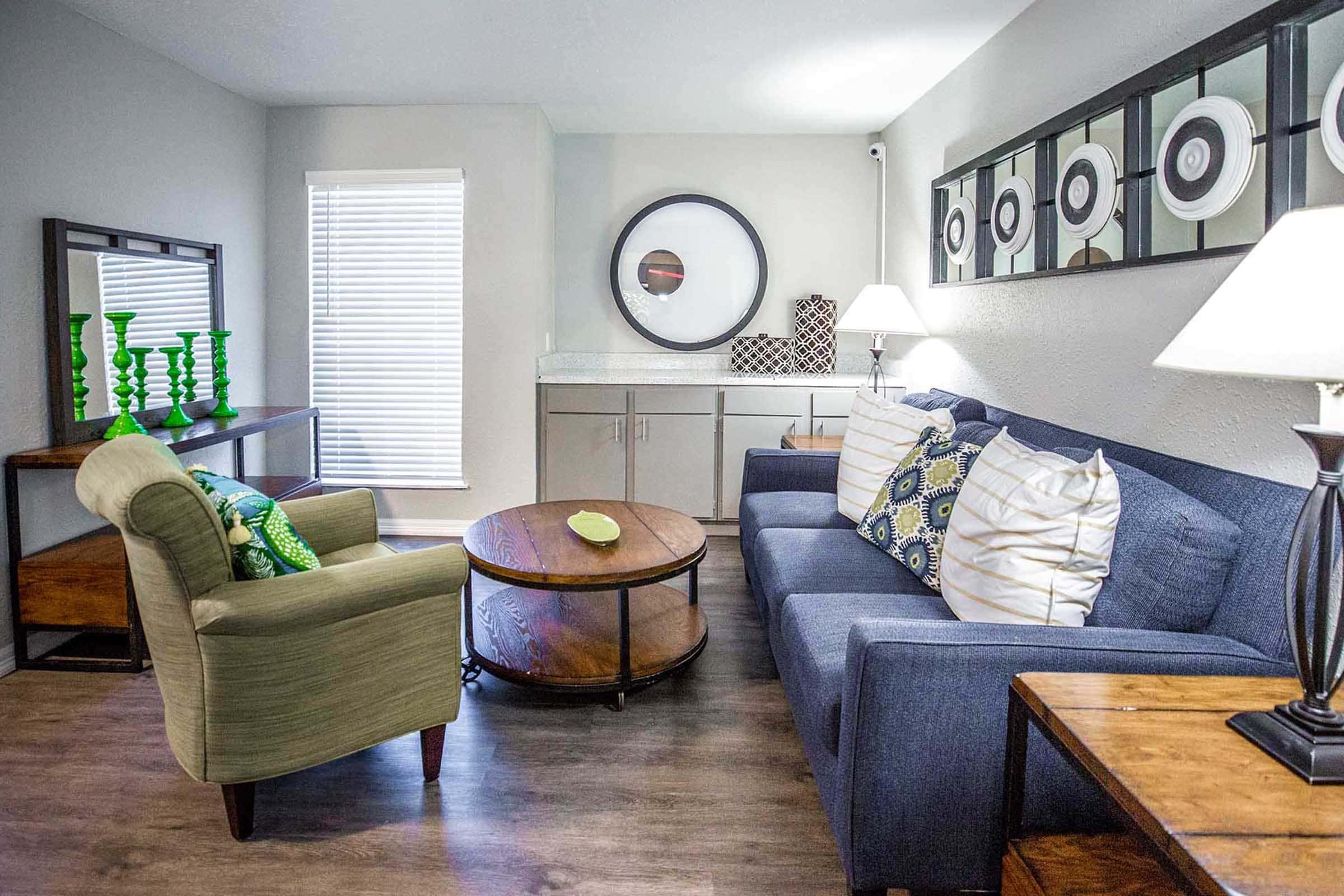 a living room filled with furniture and a fire place