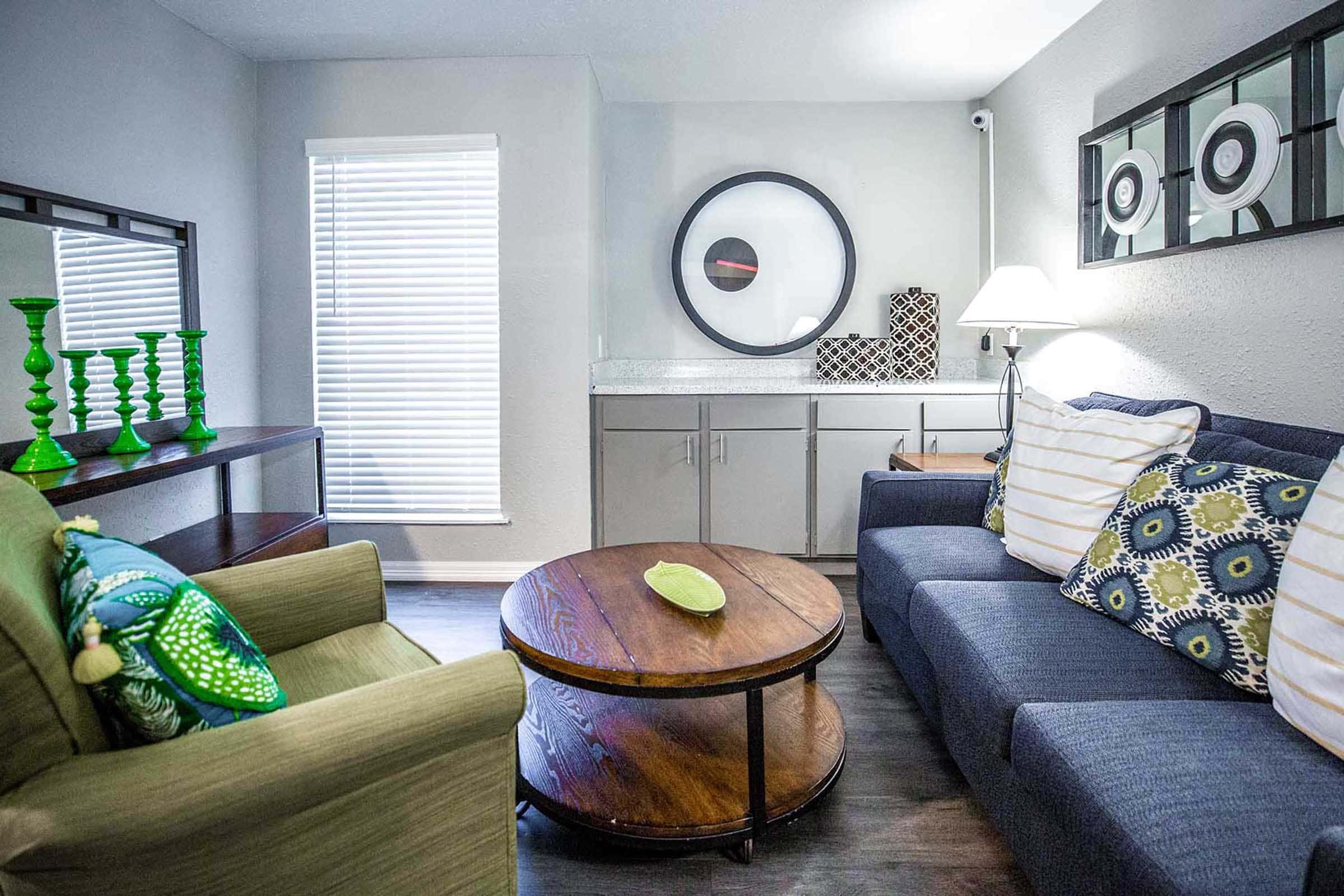 a living room with a bed and a window