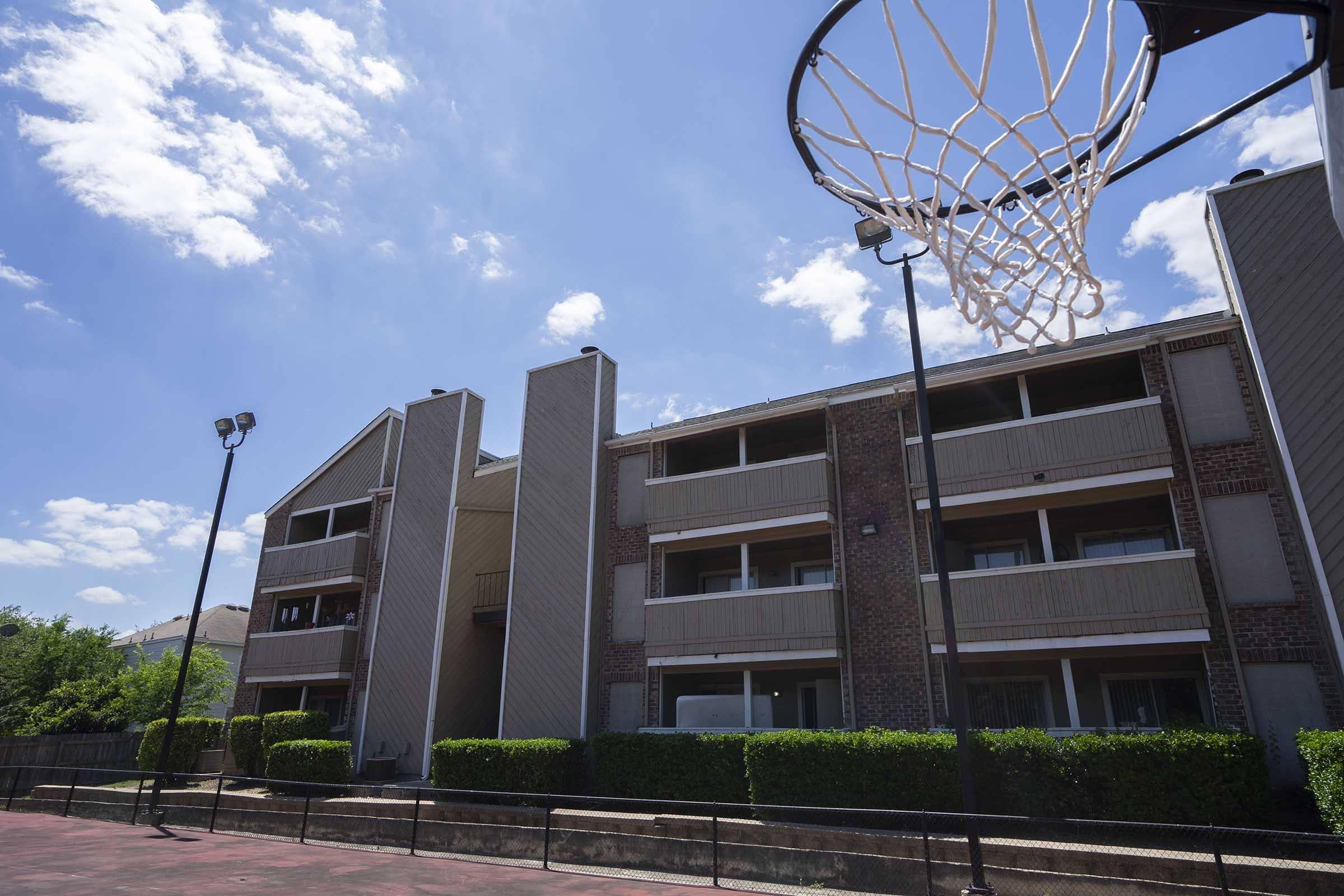 a large brick building with a metal tower