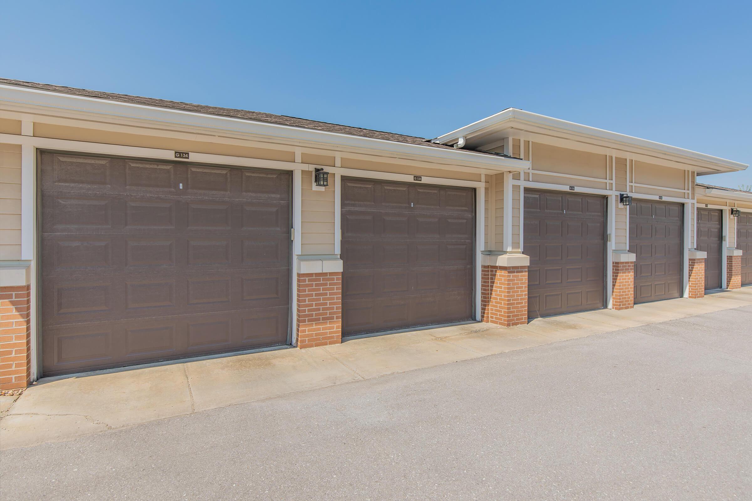 an empty parking lot in front of a brick building