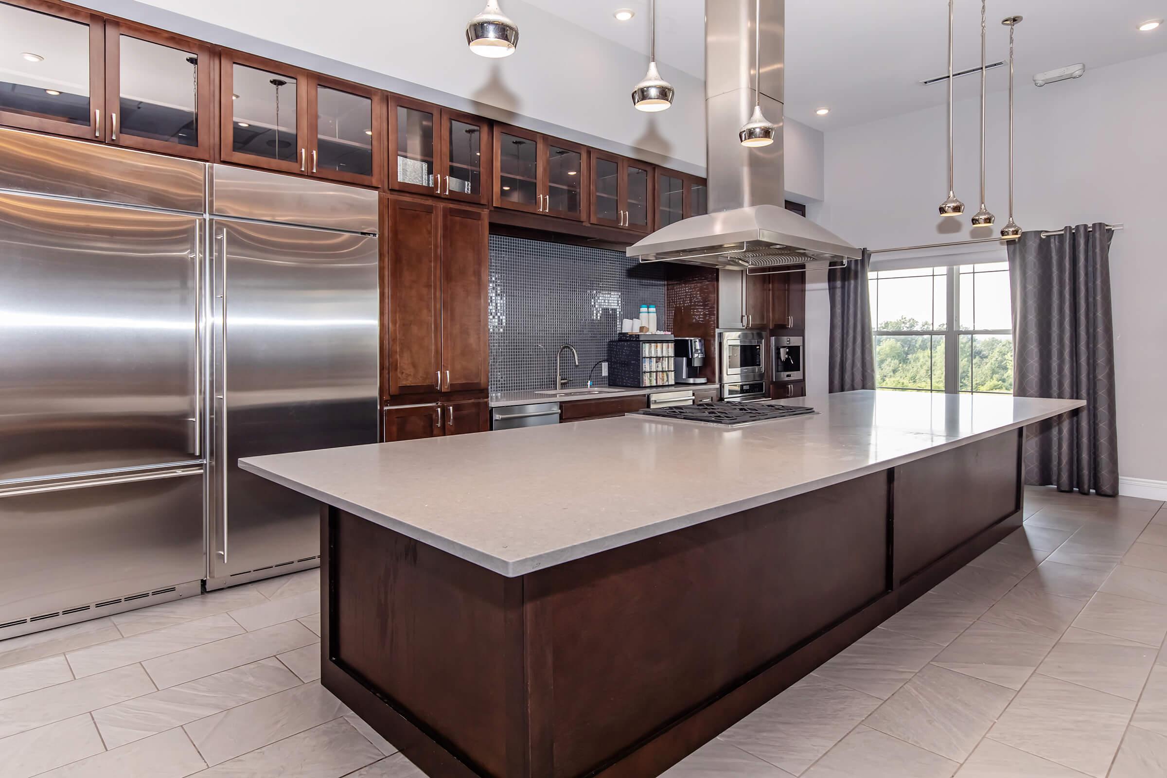 a large kitchen with stainless steel appliances