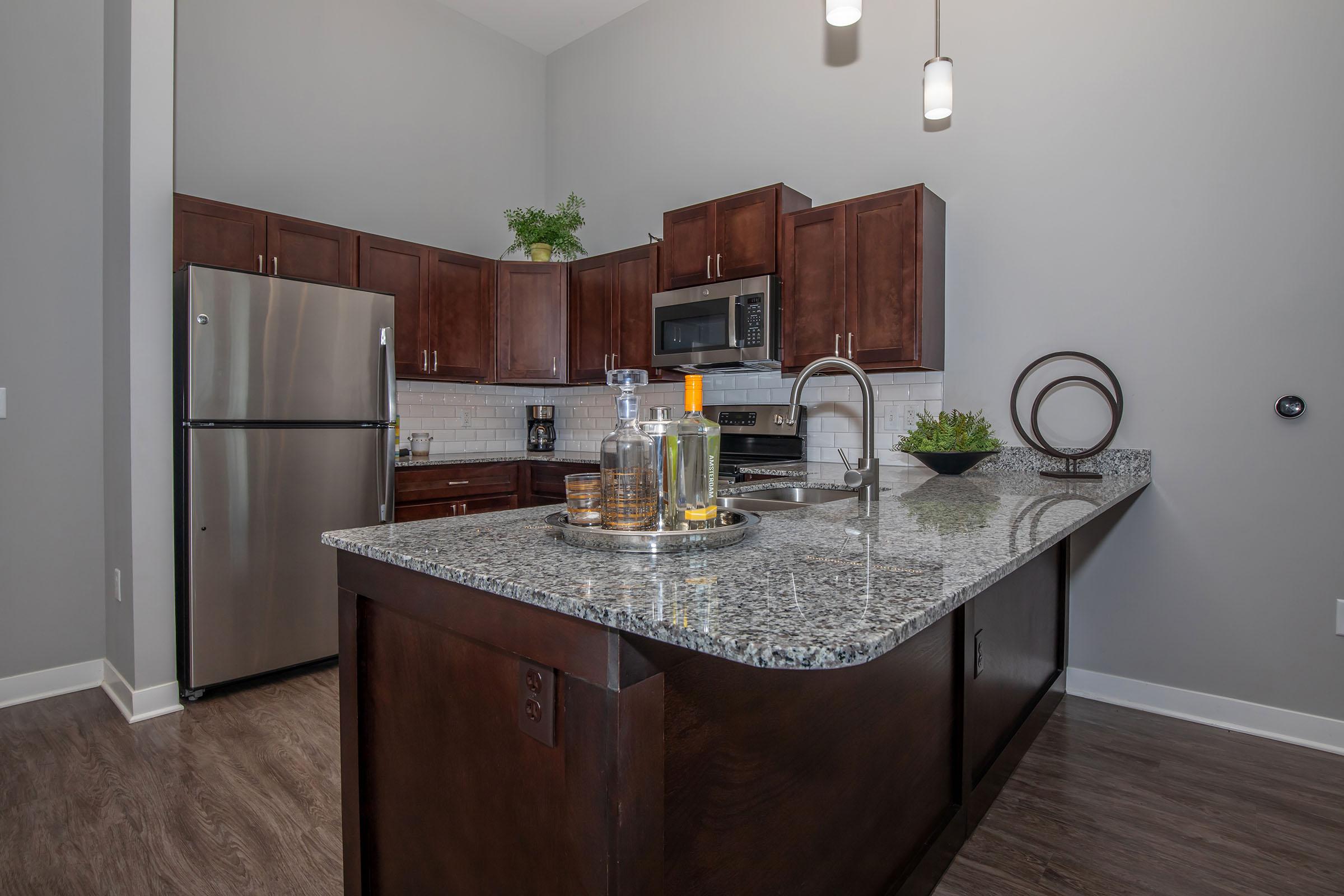 a kitchen with a sink and a refrigerator