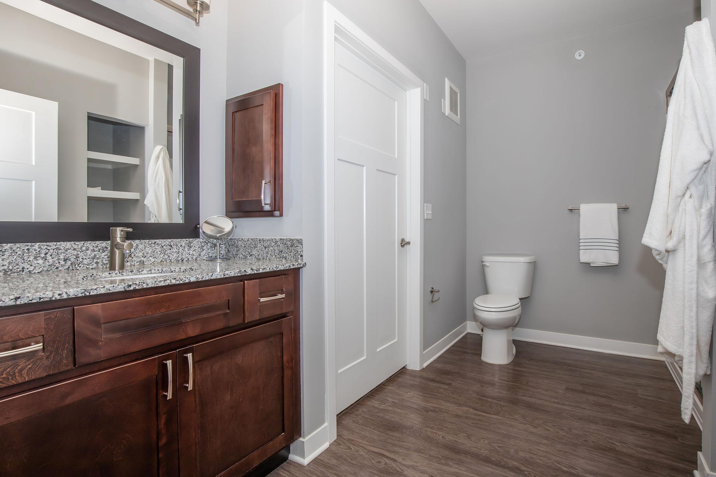 a kitchen with a sink and a mirror