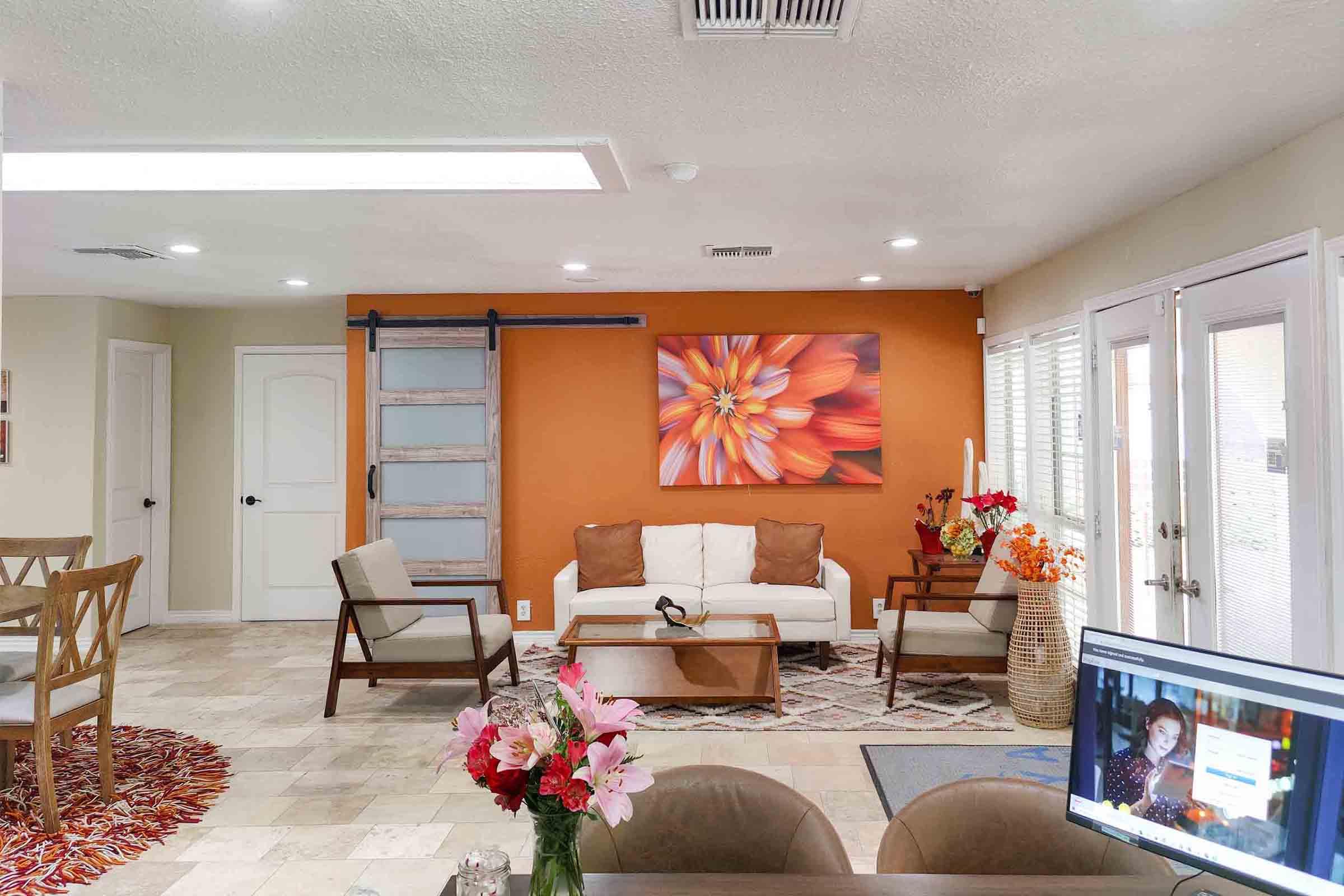 a living room filled with furniture and a fire place