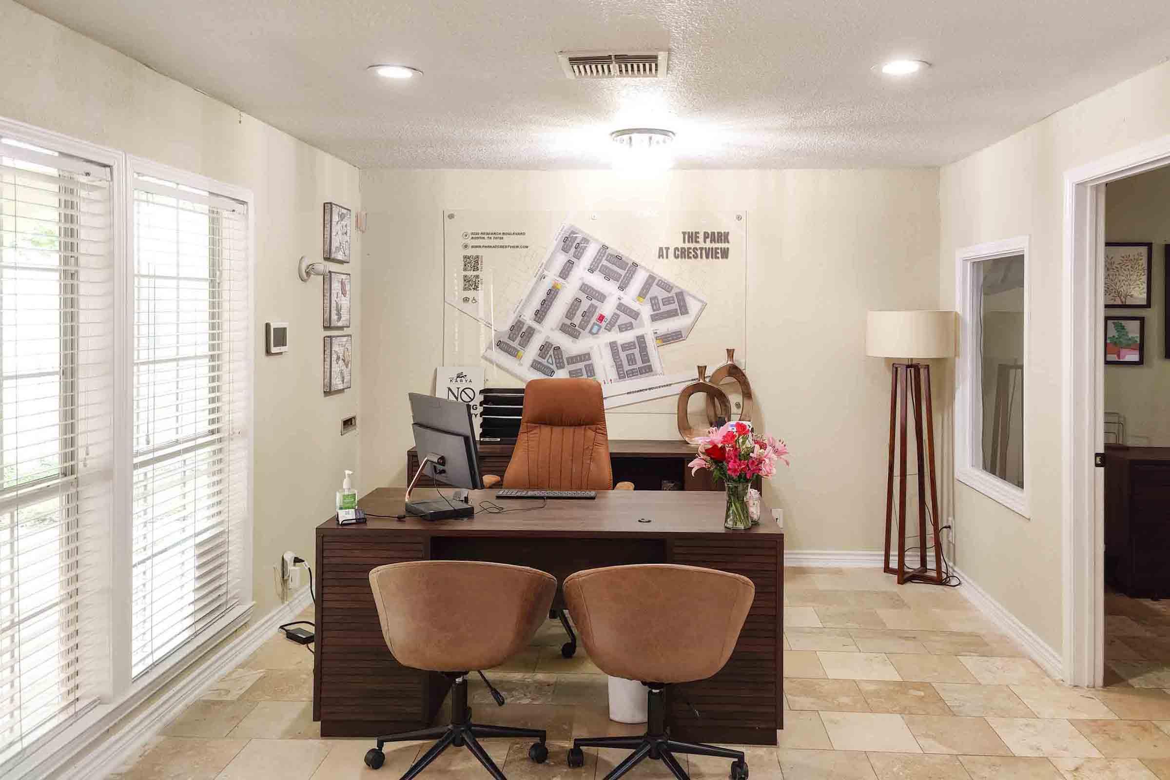 a living room filled with furniture and a large window