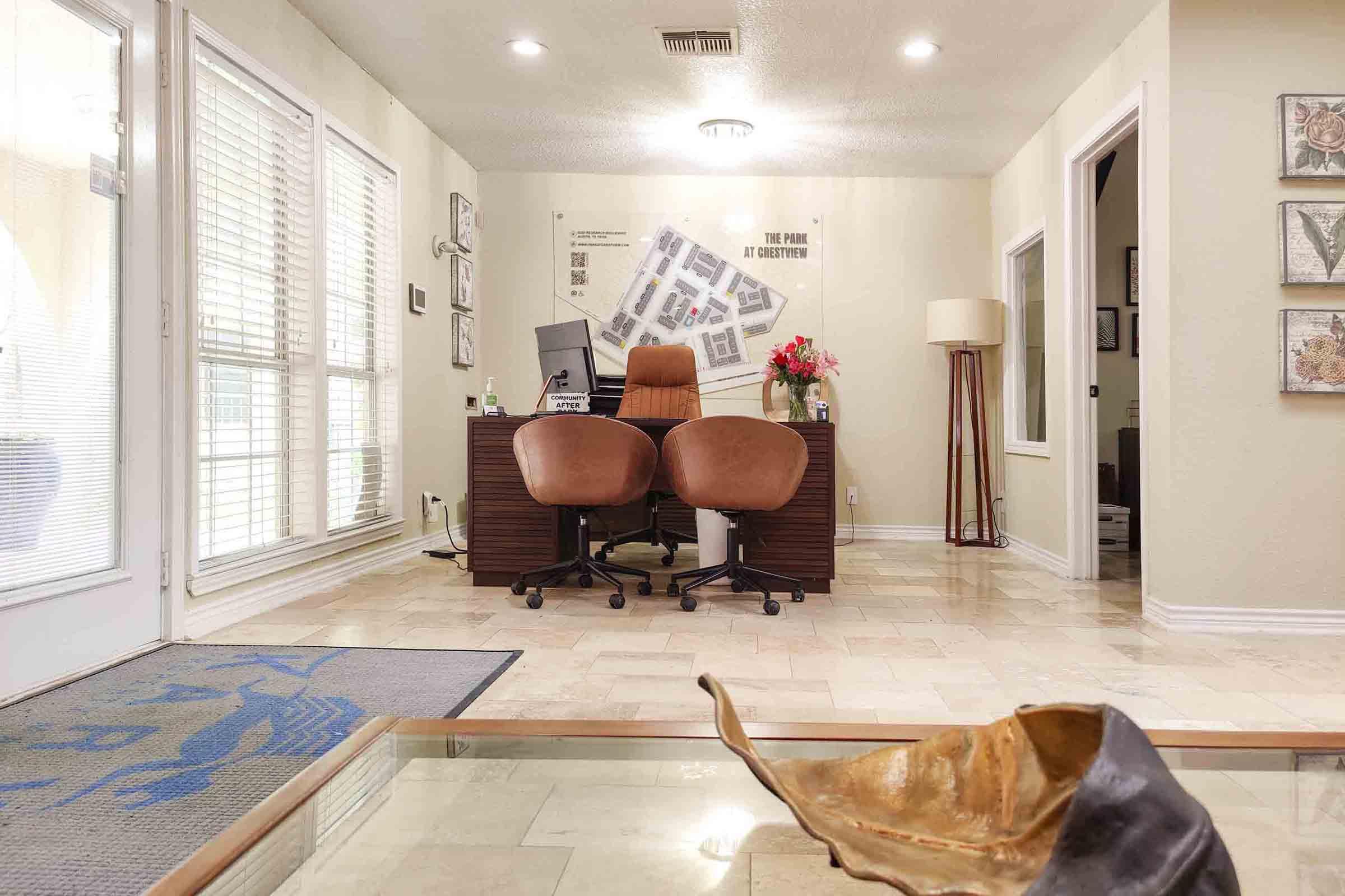 a living room filled with furniture and a large window