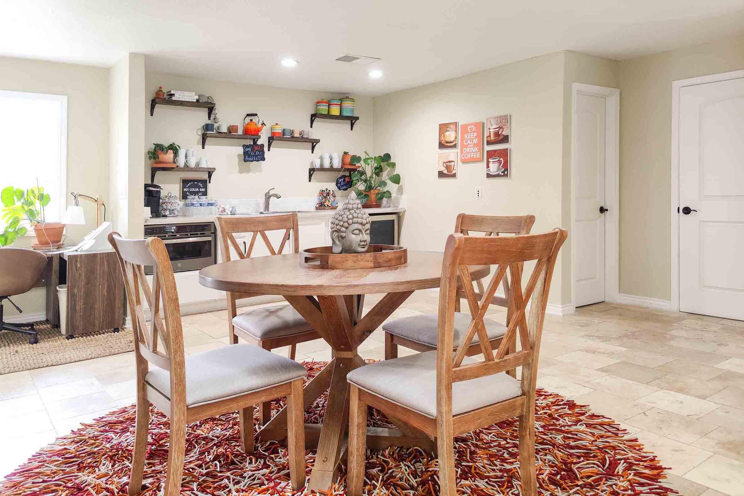 a living room filled with furniture and a rug