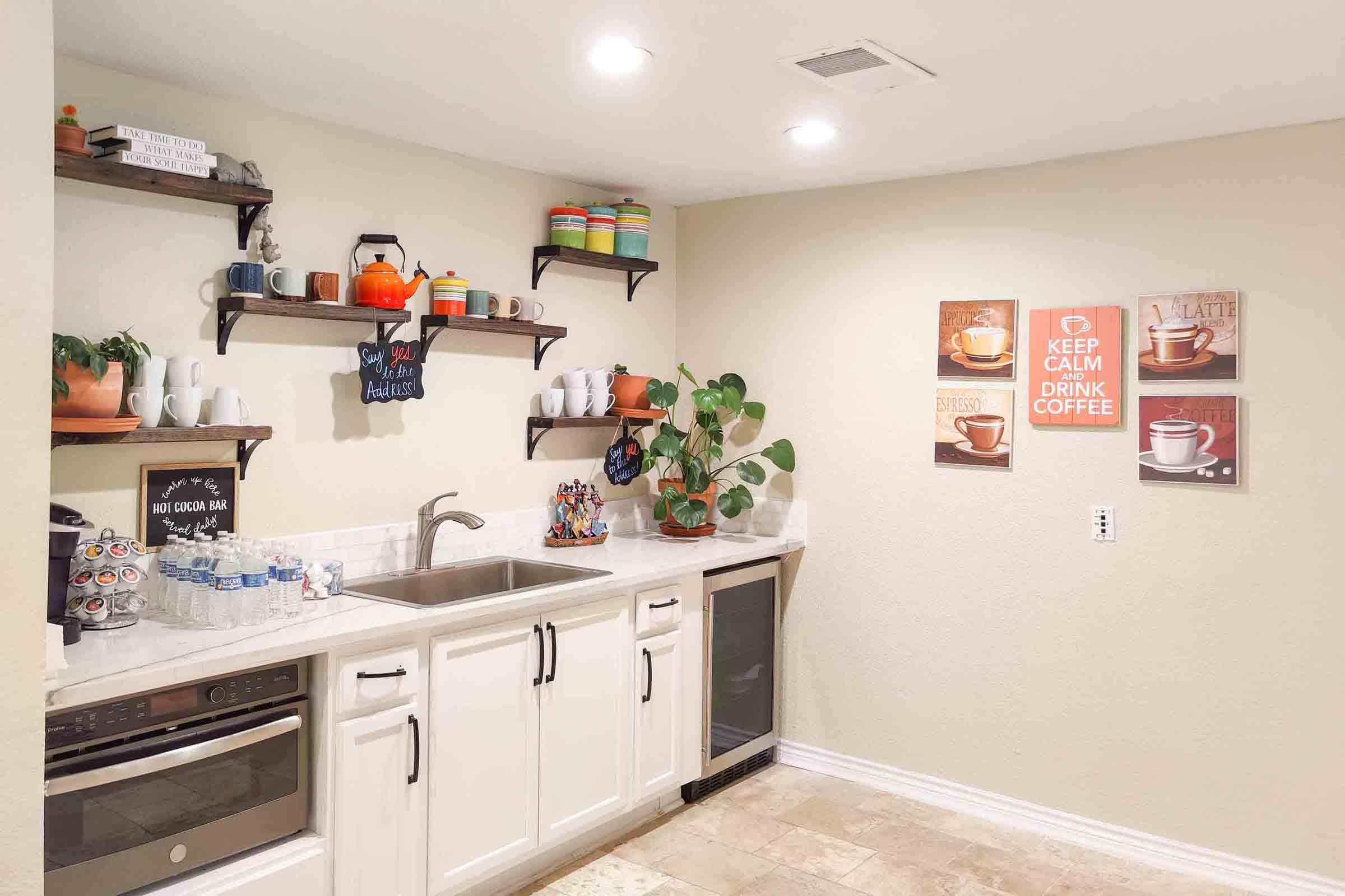 a kitchen with a sink and a refrigerator