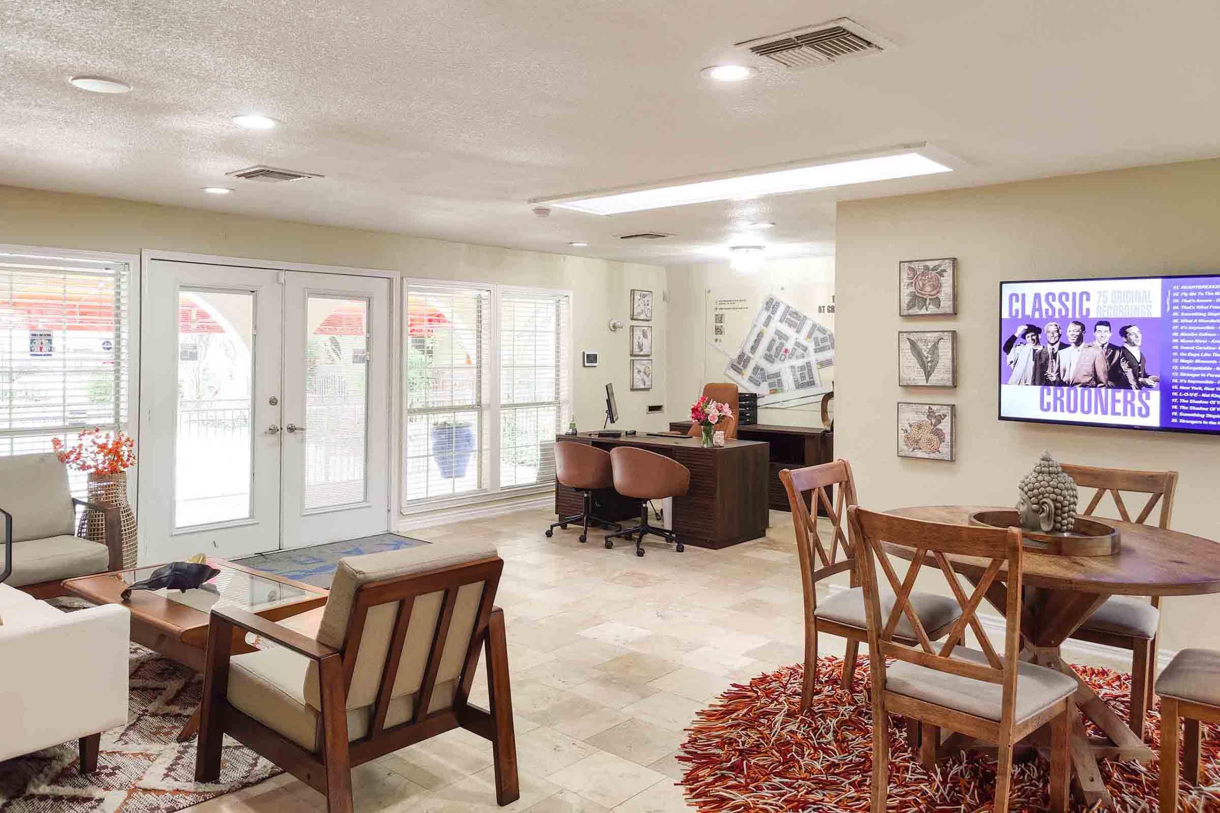 a living room filled with furniture and a table