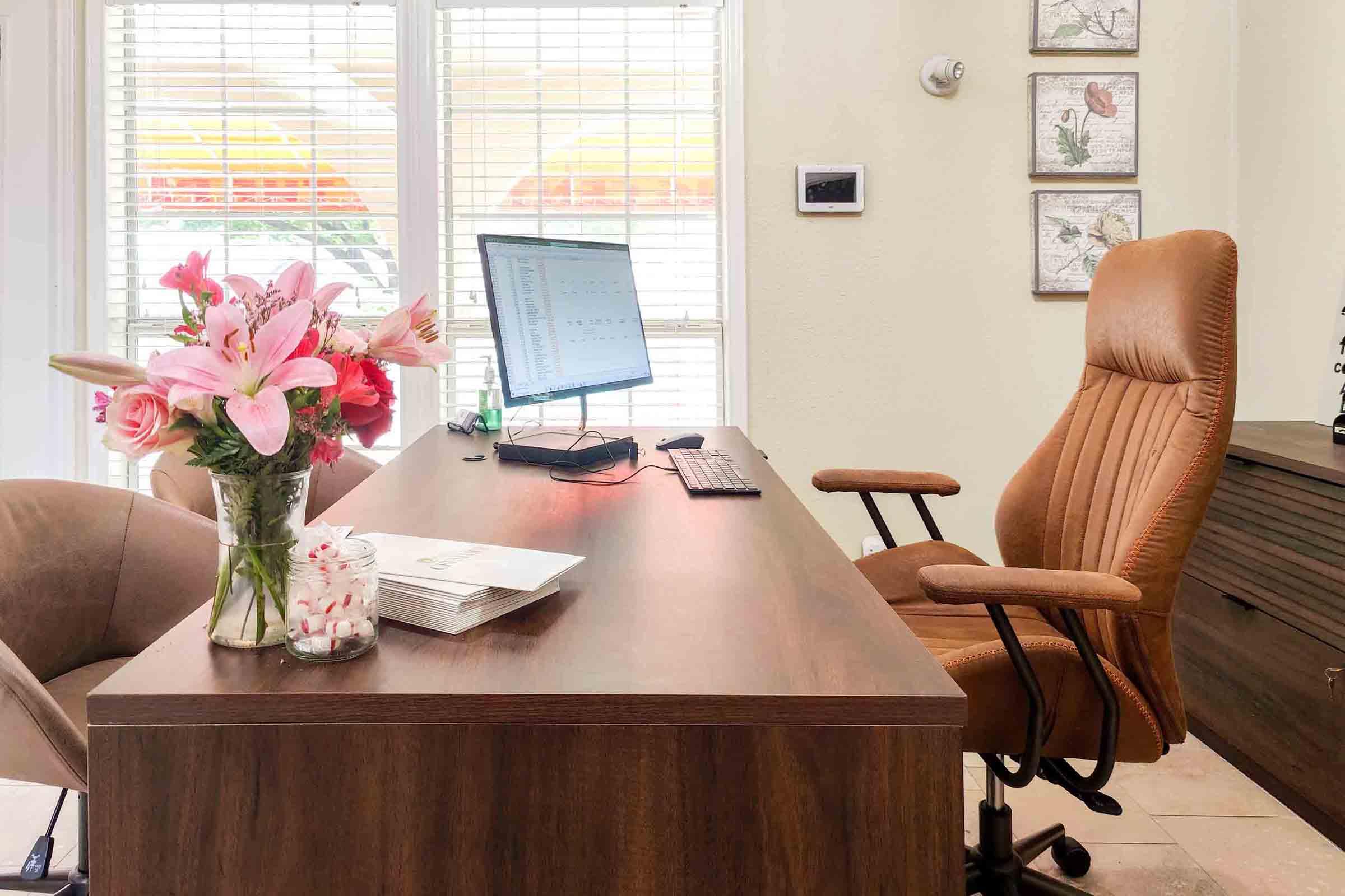 a living room filled with furniture and a large window