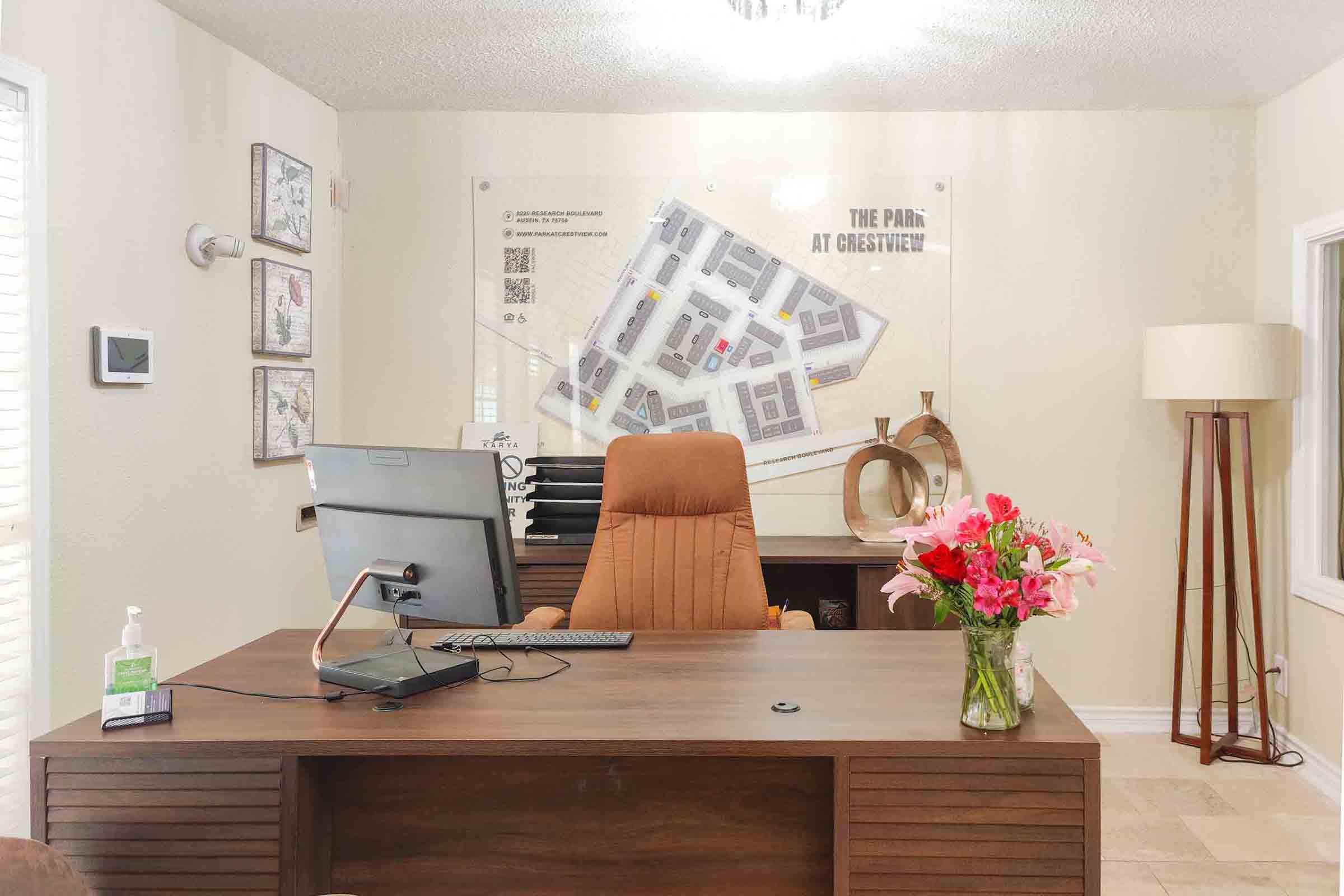 a living room filled with furniture and vase of flowers on a table