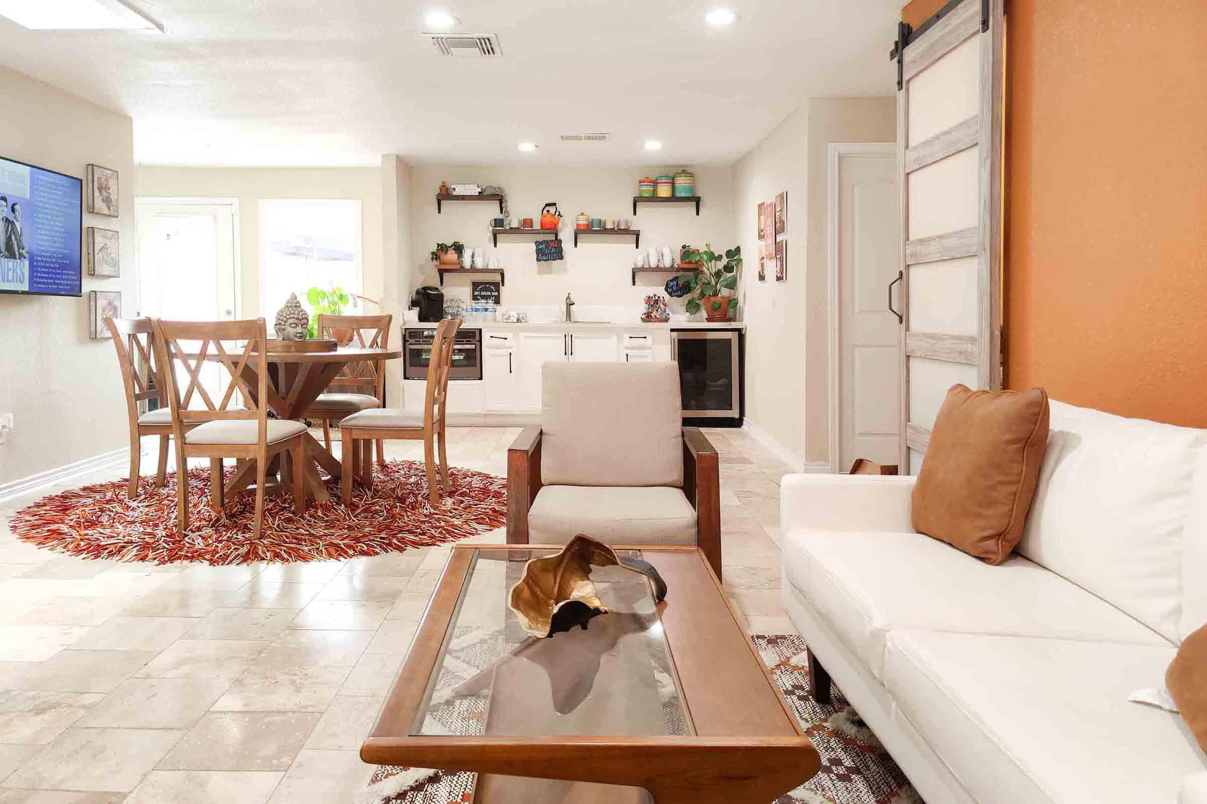 a living room filled with furniture and a fire place