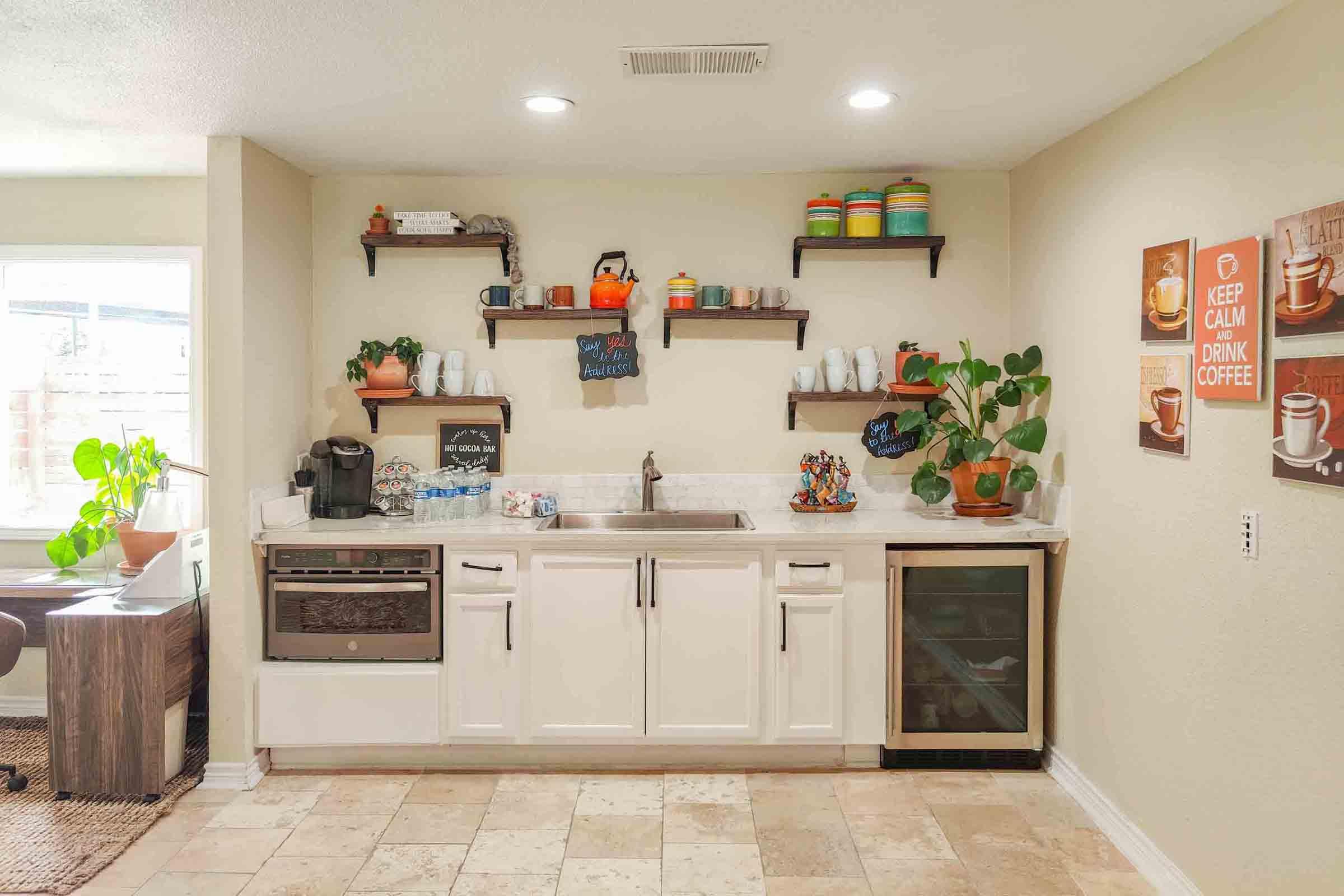 a kitchen filled with lots of furniture