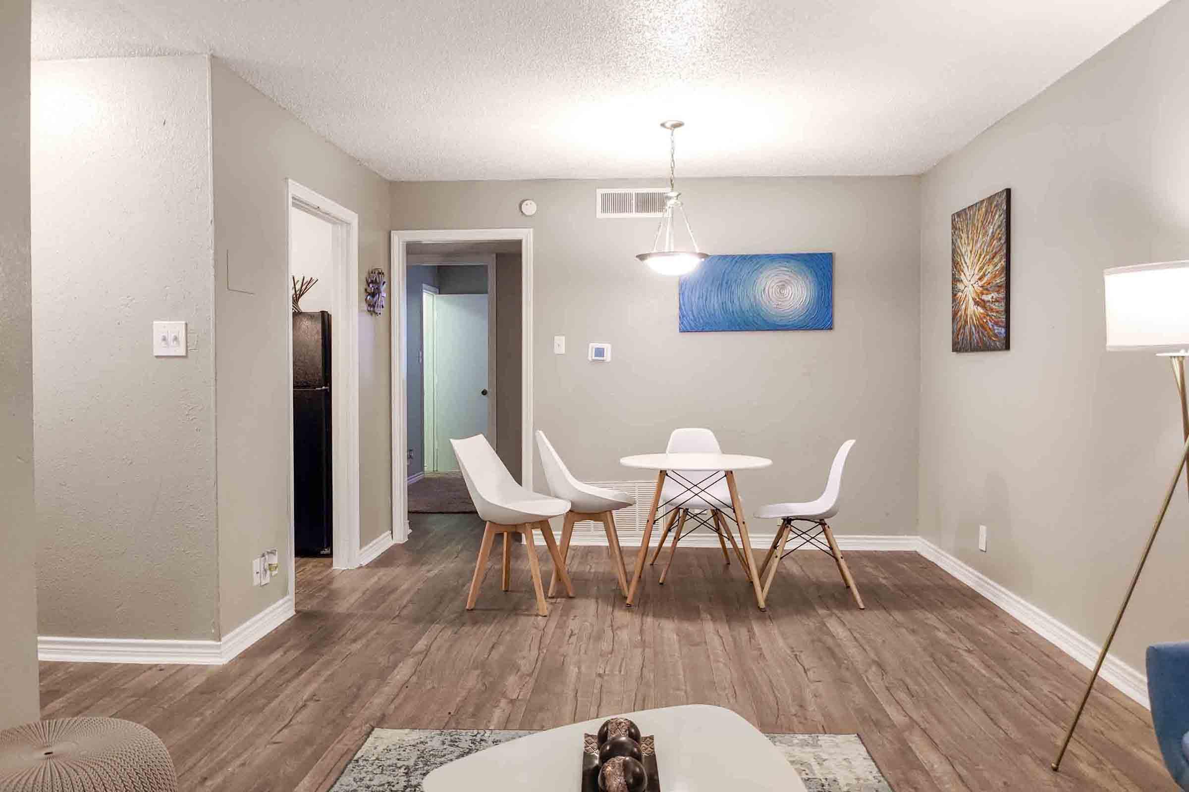 a living room filled with furniture and a mirror