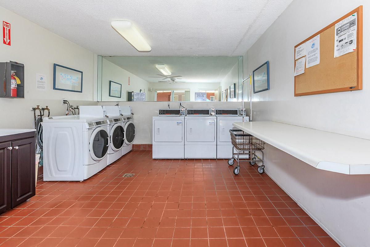 a kitchen with a tiled floor in a room