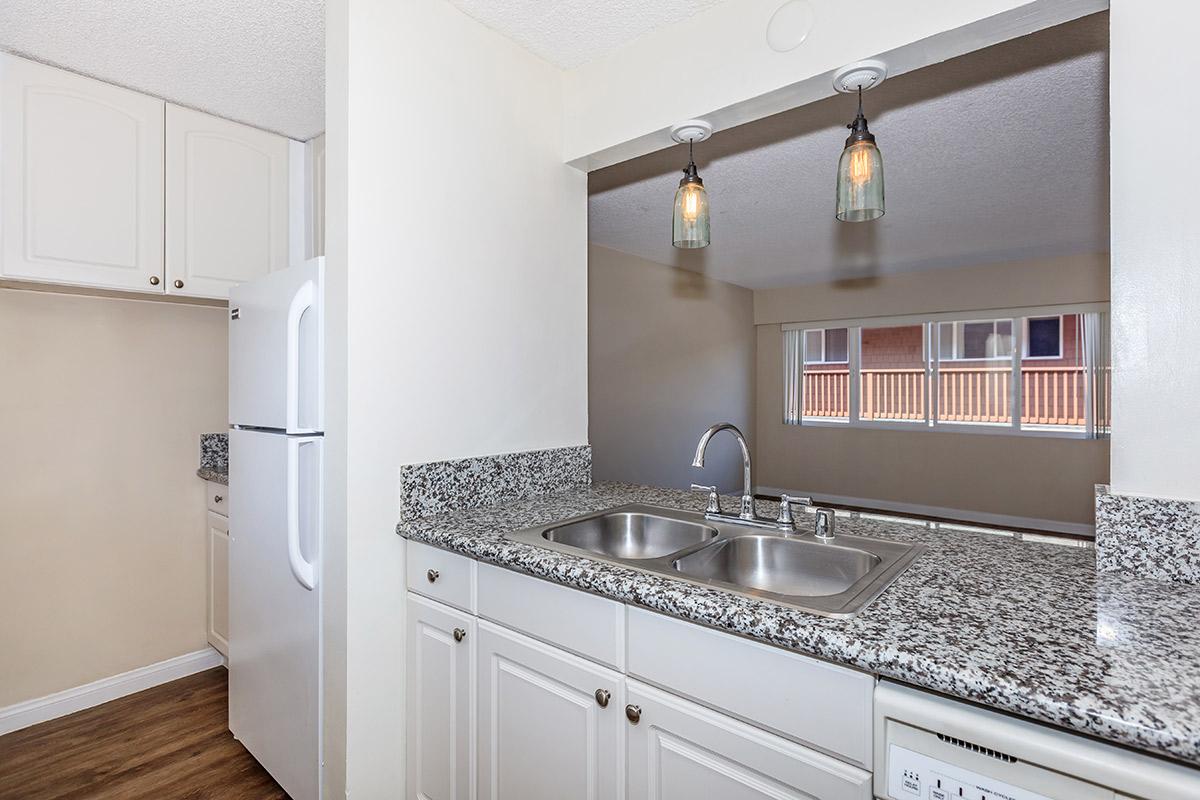 a kitchen with a stove and a sink