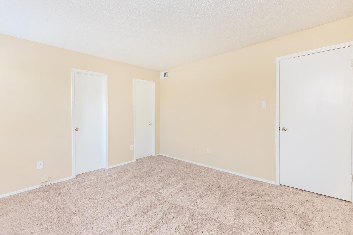 a bedroom with a bed in a room