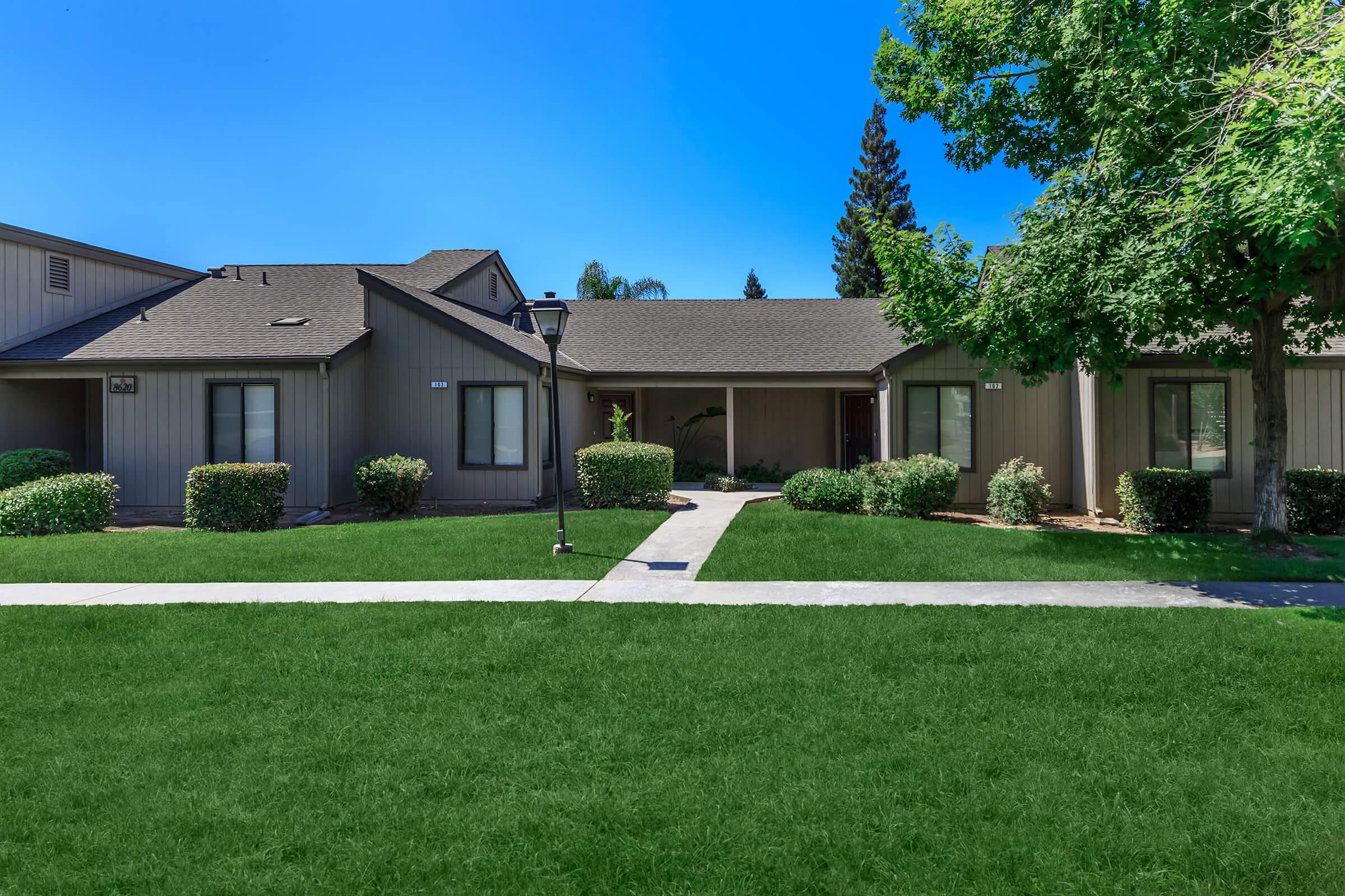 a large lawn in front of a house