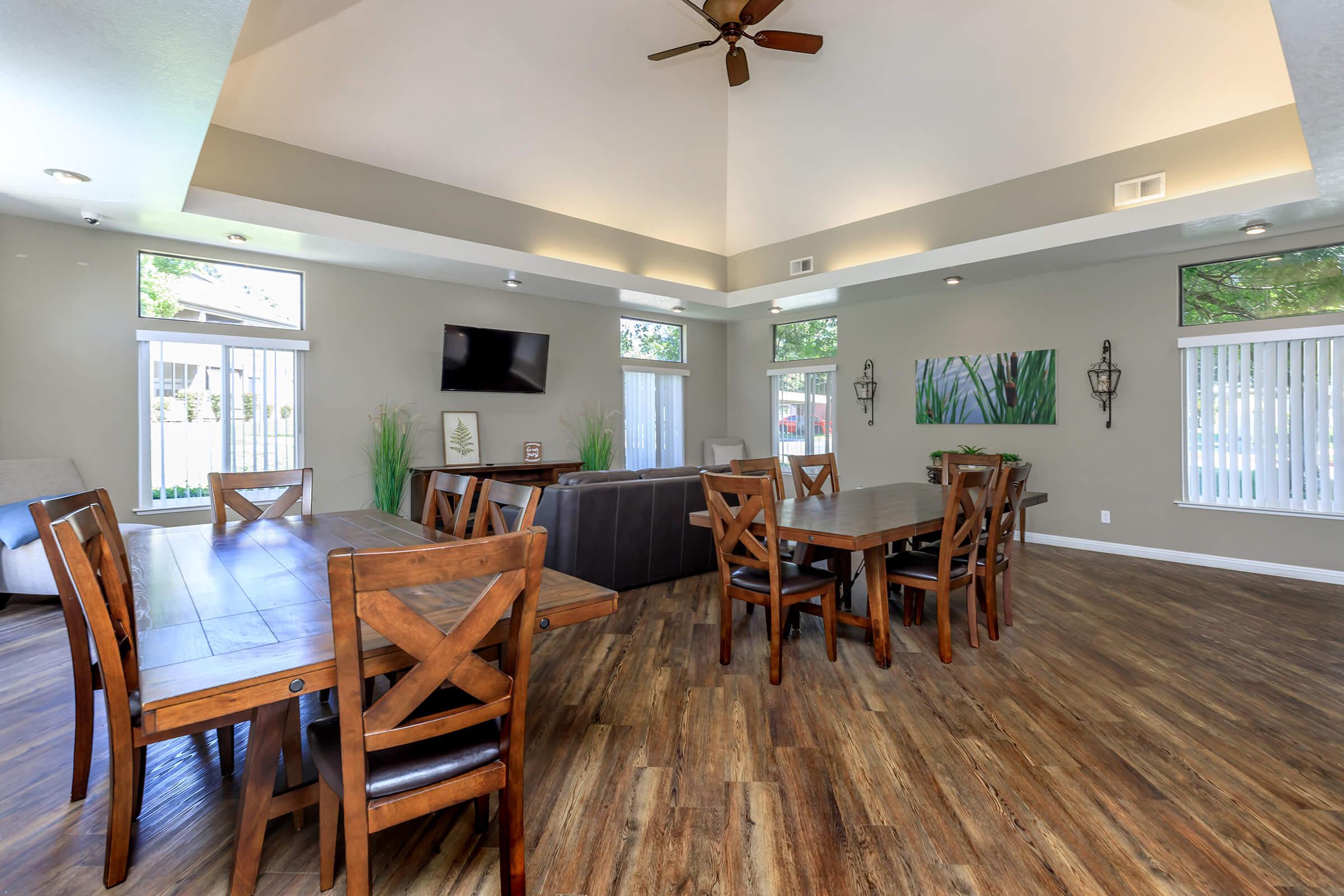 a living room filled with furniture on top of a wooden table