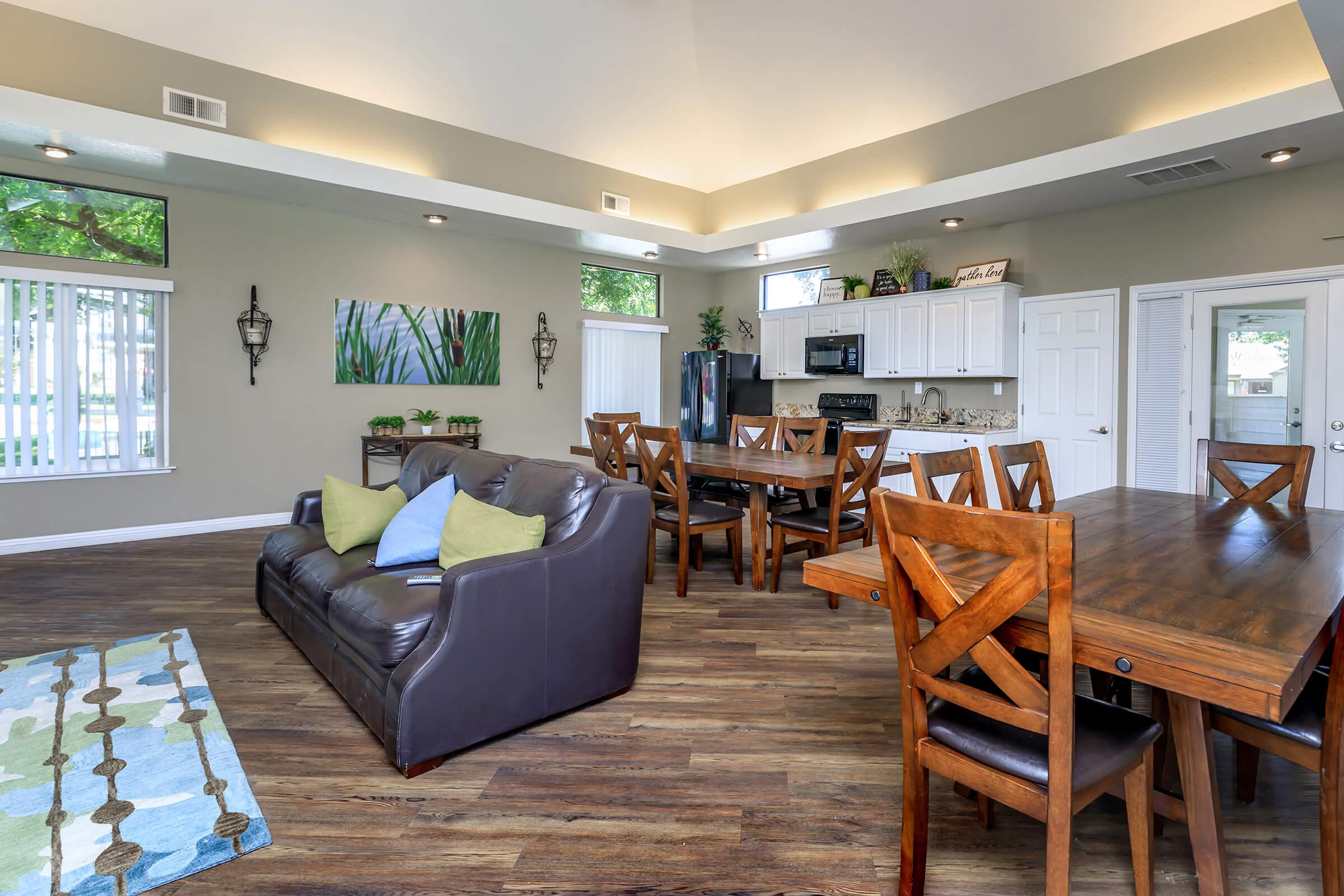 a living room filled with furniture on top of a wooden table