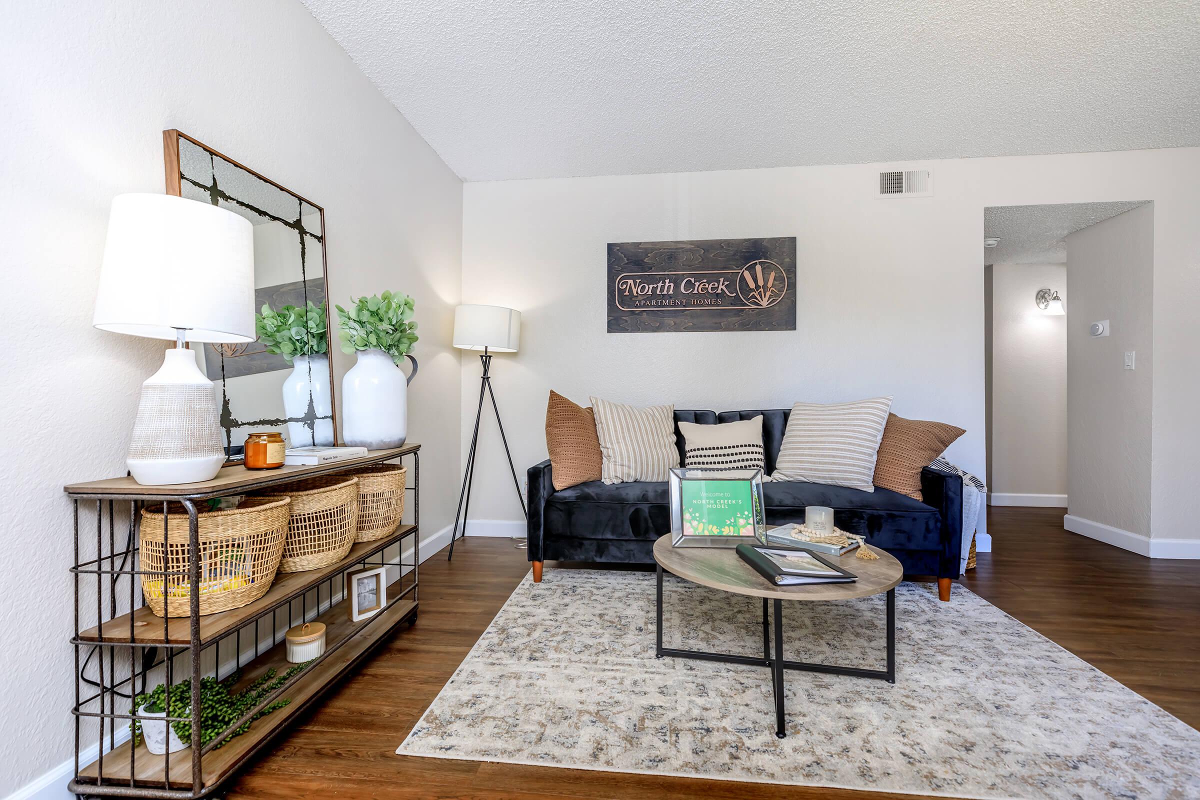 a living room filled with furniture on top of a wooden table