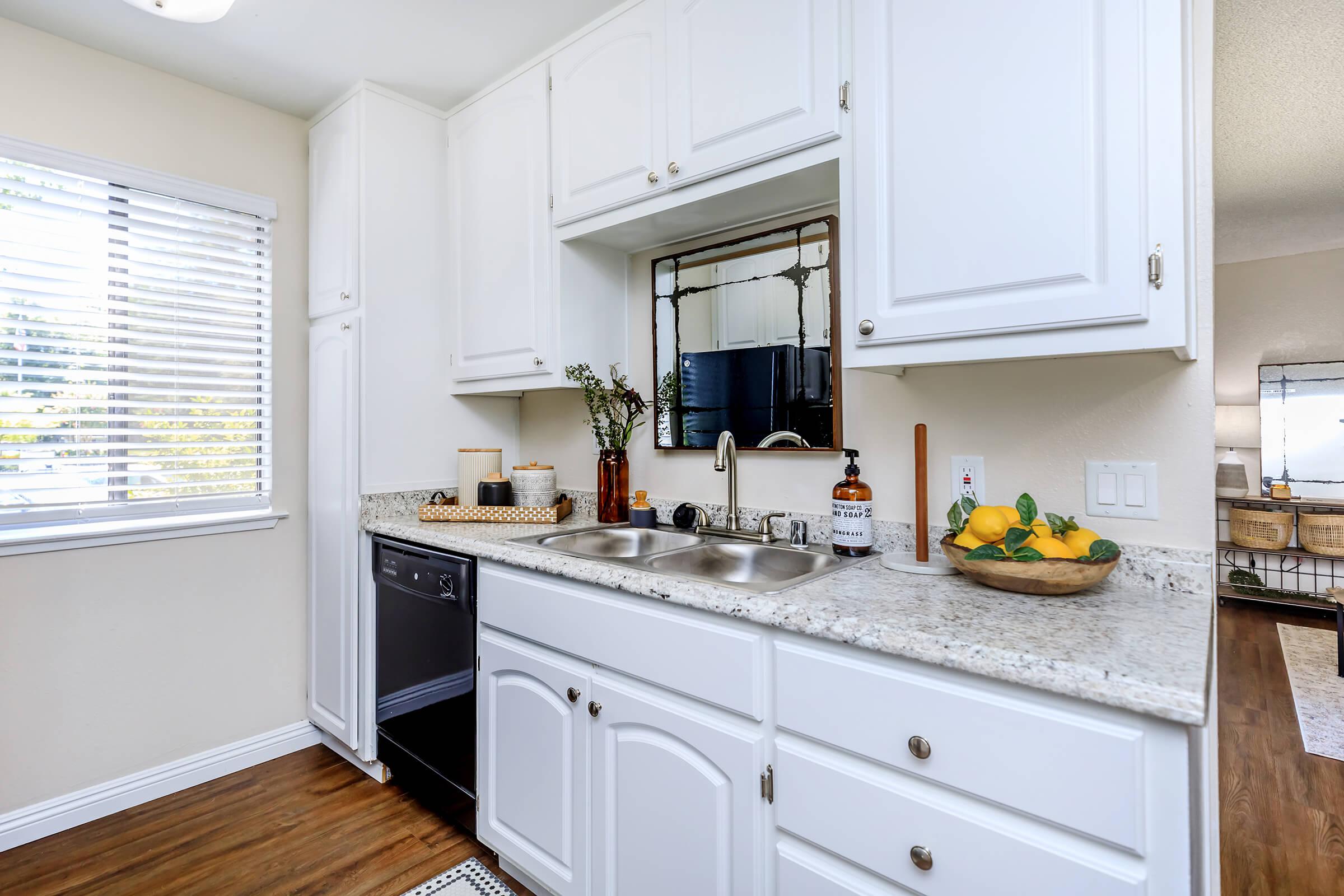 a kitchen with a sink and a window