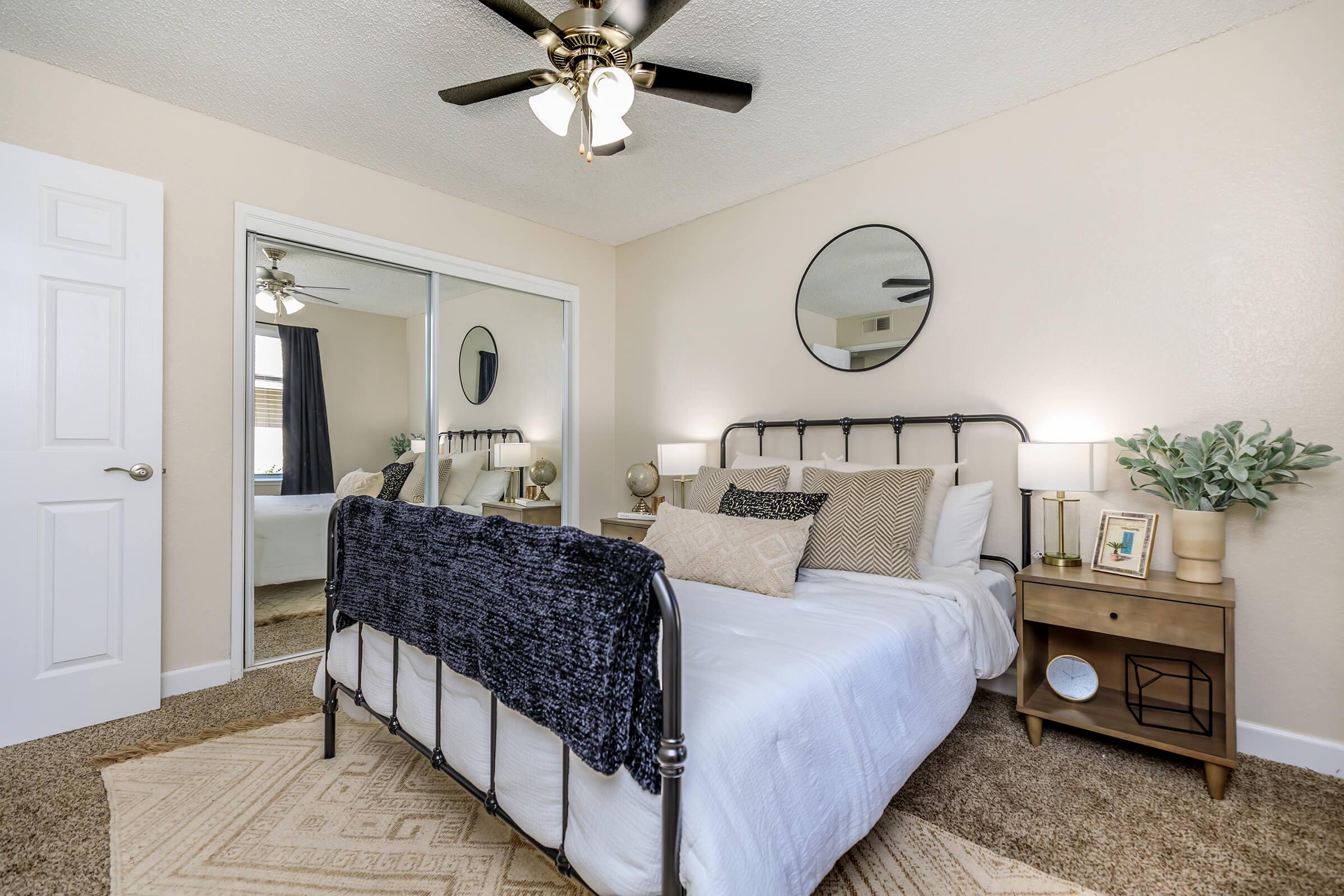 MIRRORED CLOSET DOORS IN BEDROOM