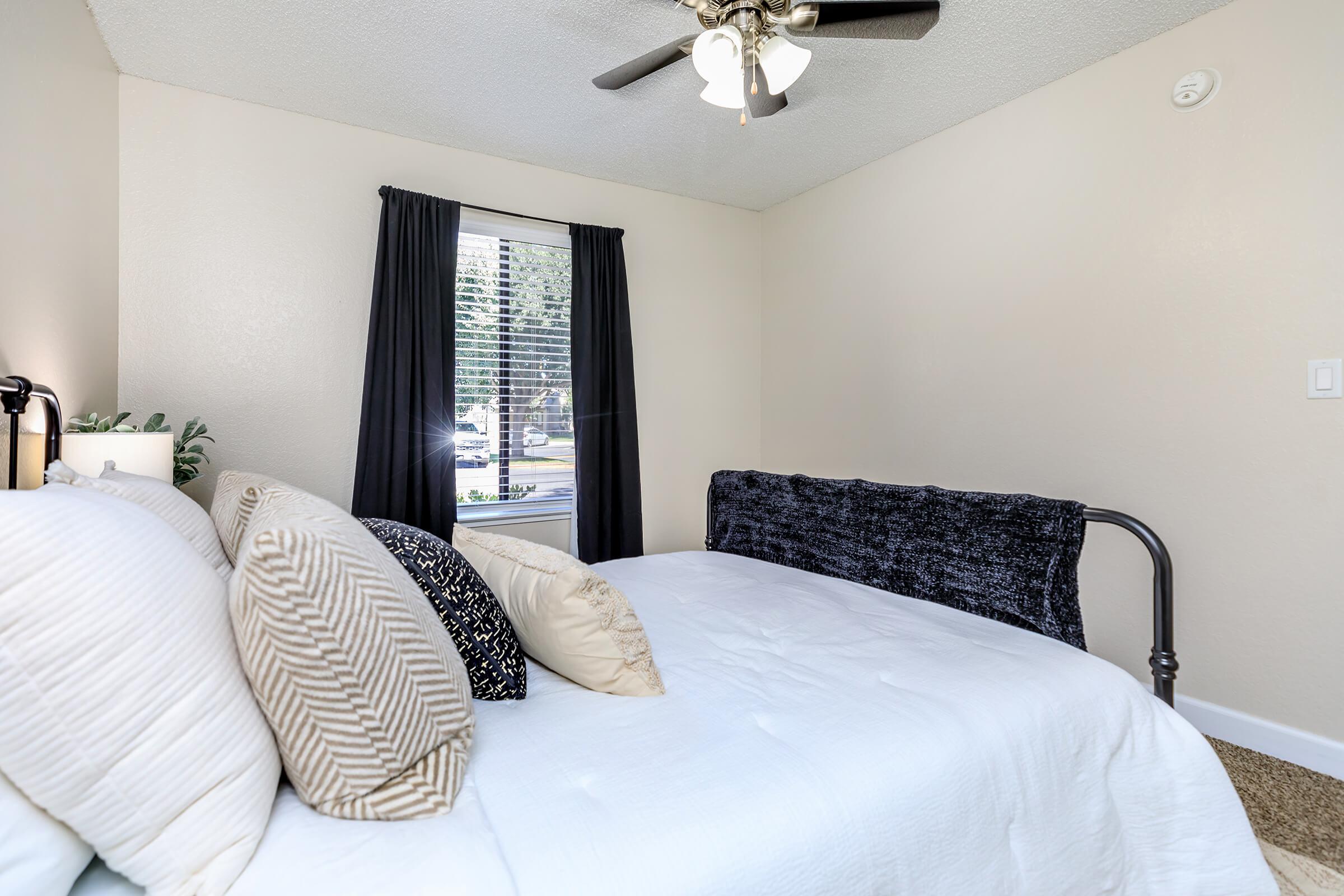 a bedroom with a bed in a hotel room