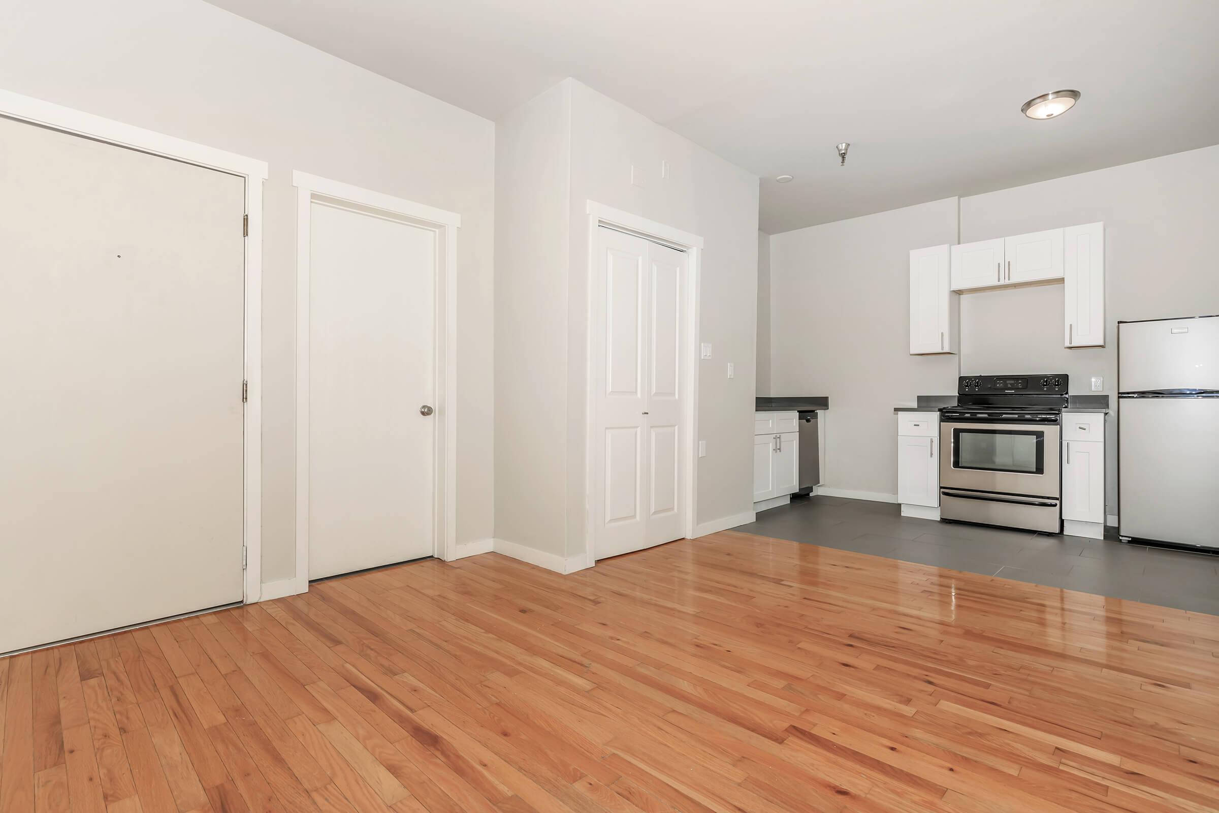 a kitchen with a wood floor