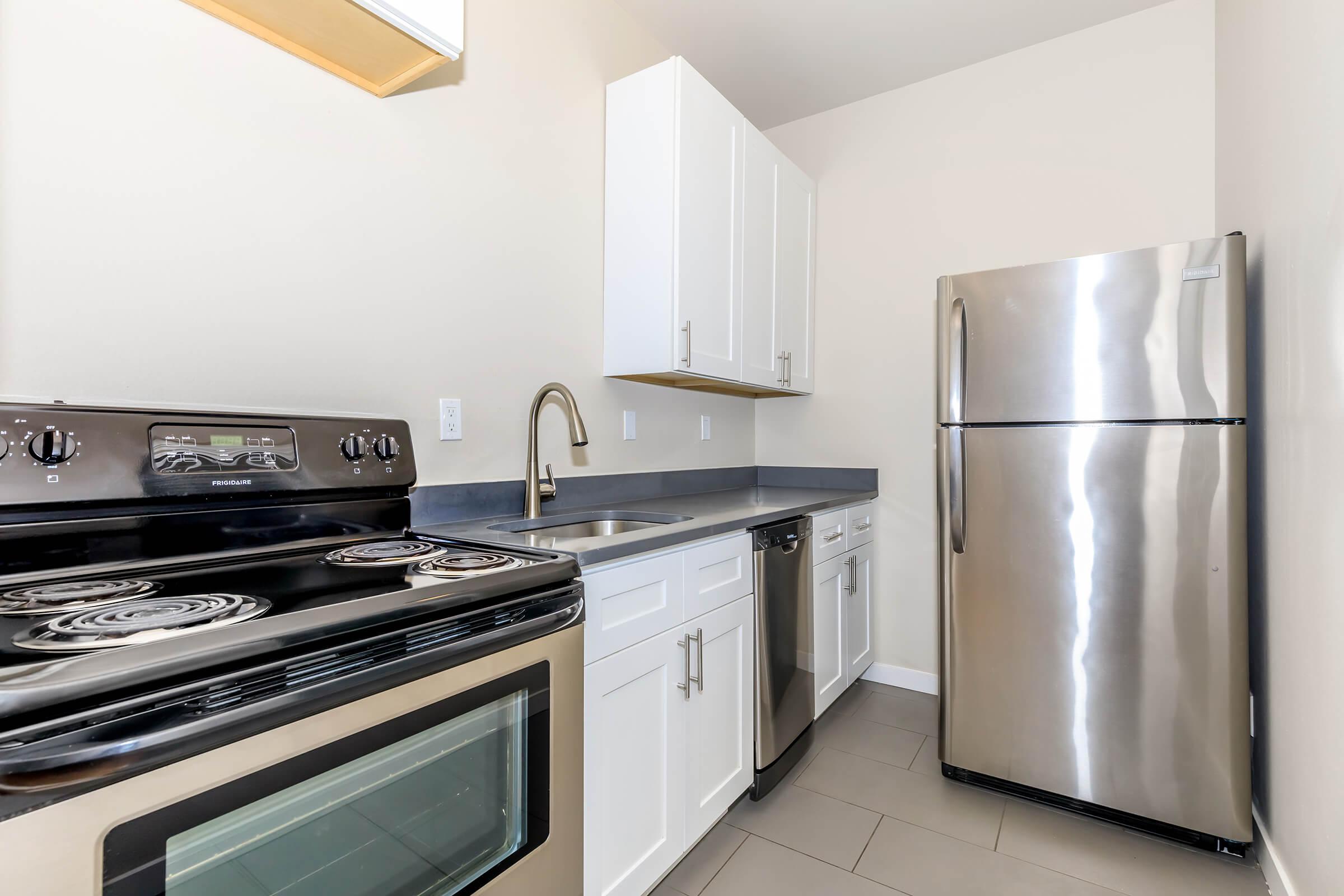 a stainless steel refrigerator in a kitchen
