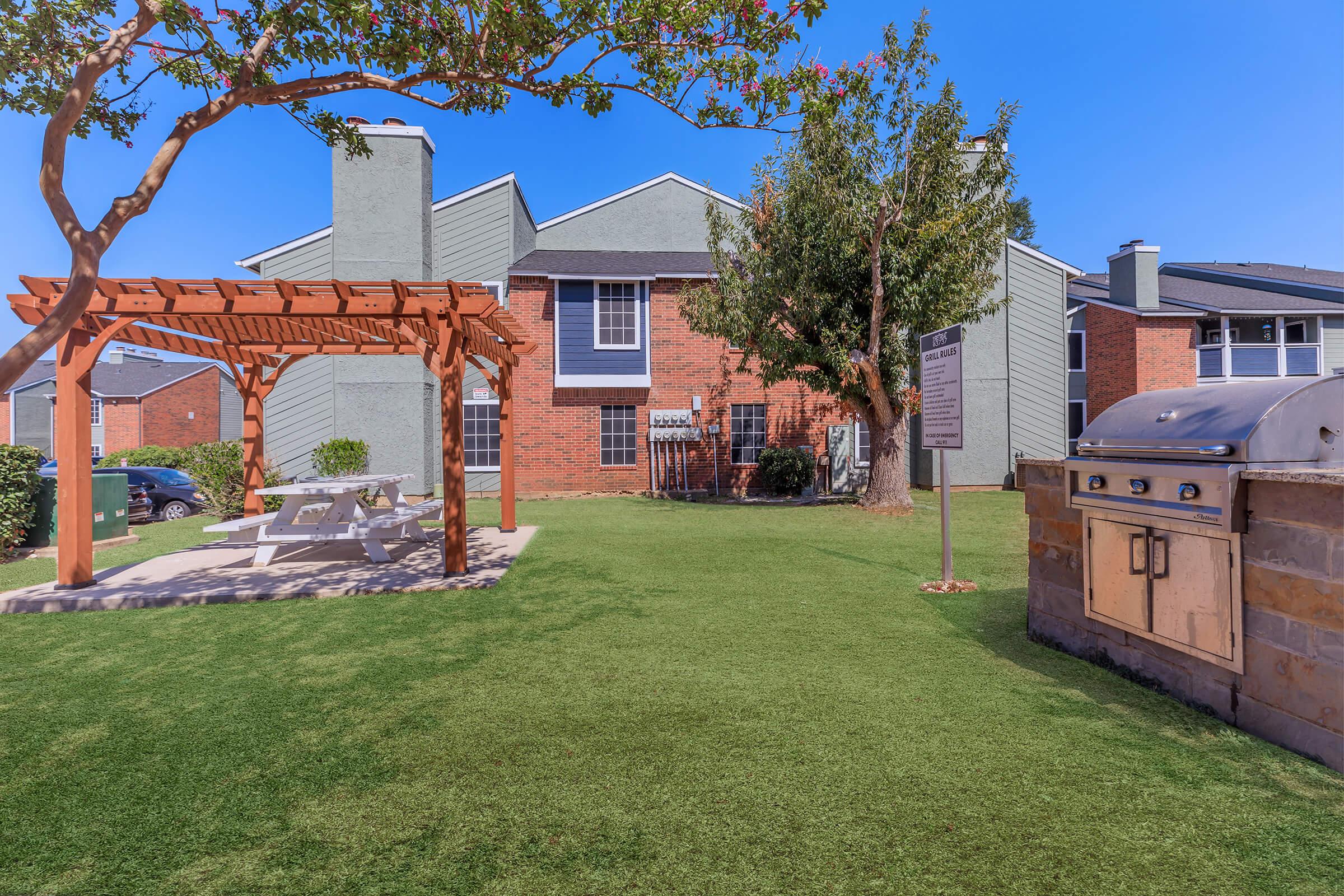 a large lawn in front of a house