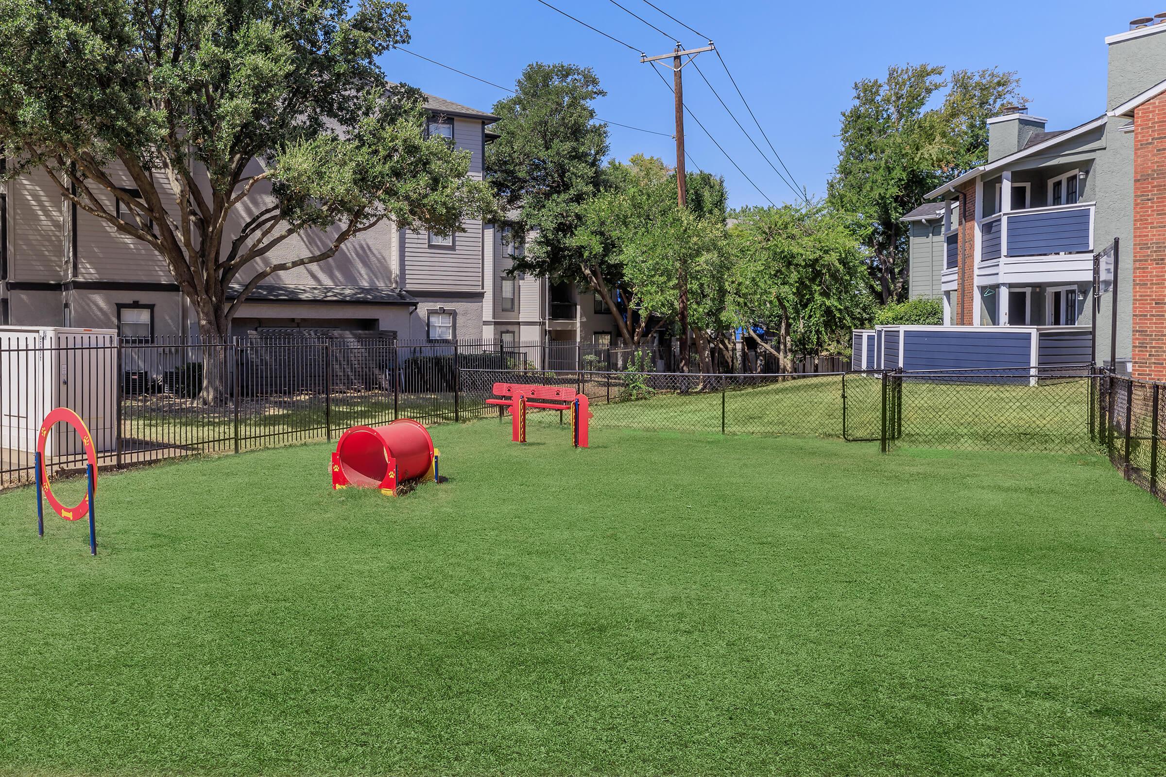 a yard with grass and a building