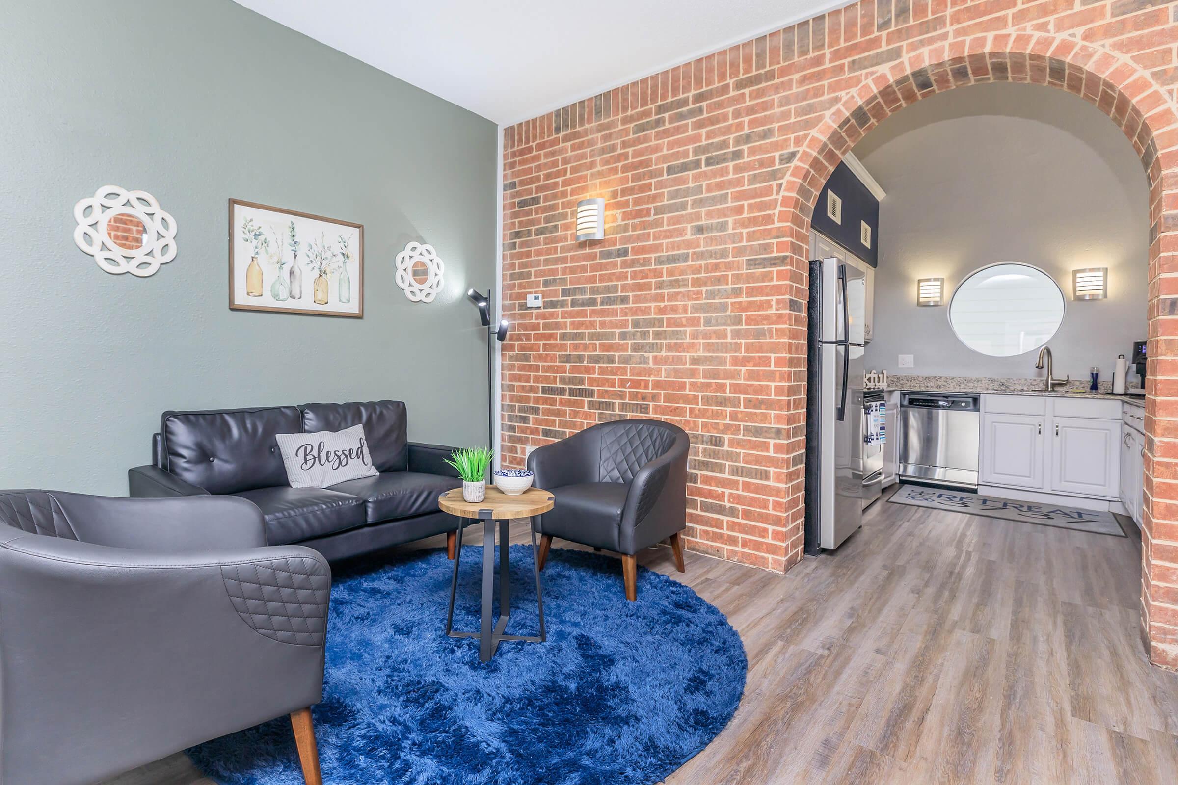 a living room filled with furniture and a fireplace