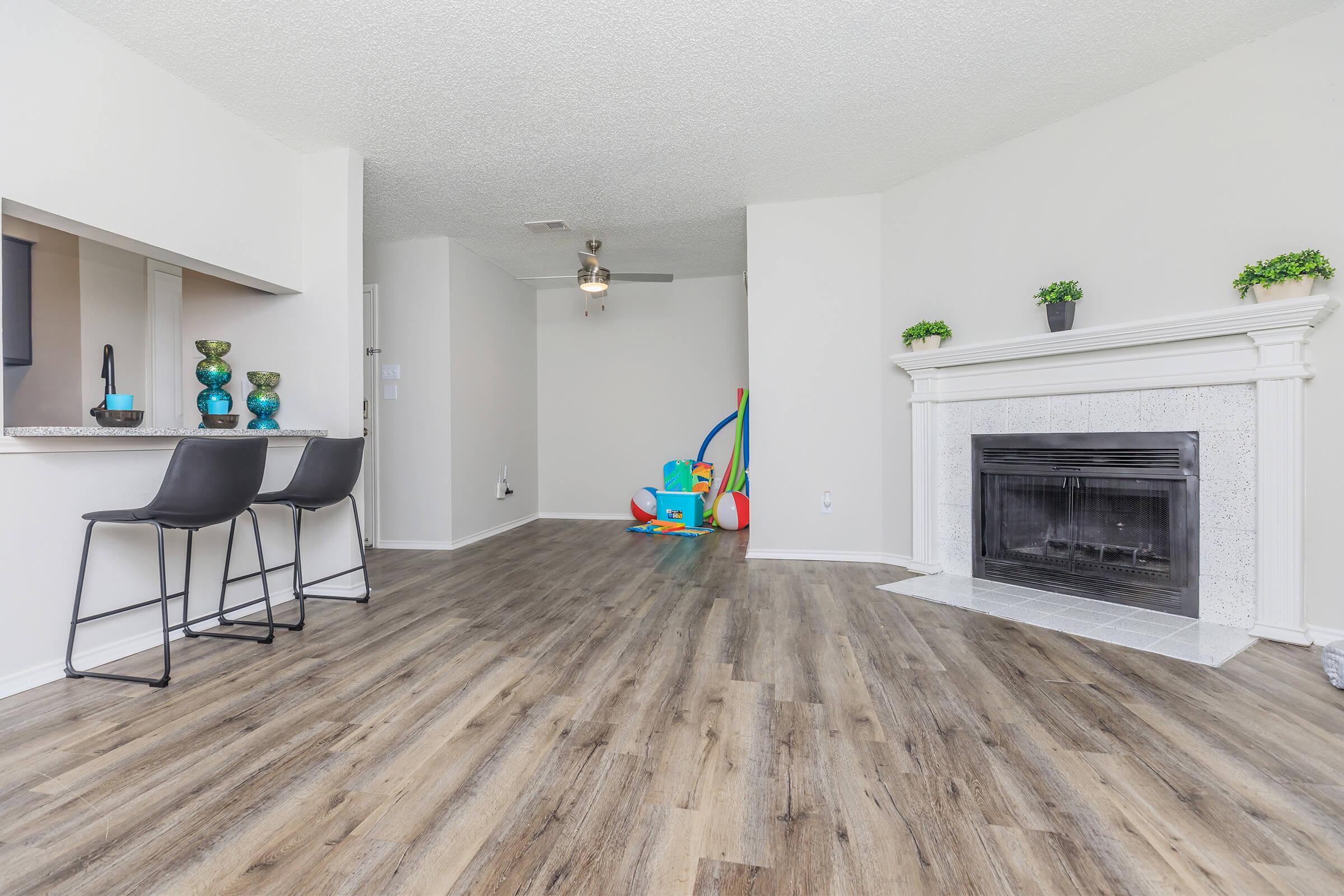 a living room with a wooden floor