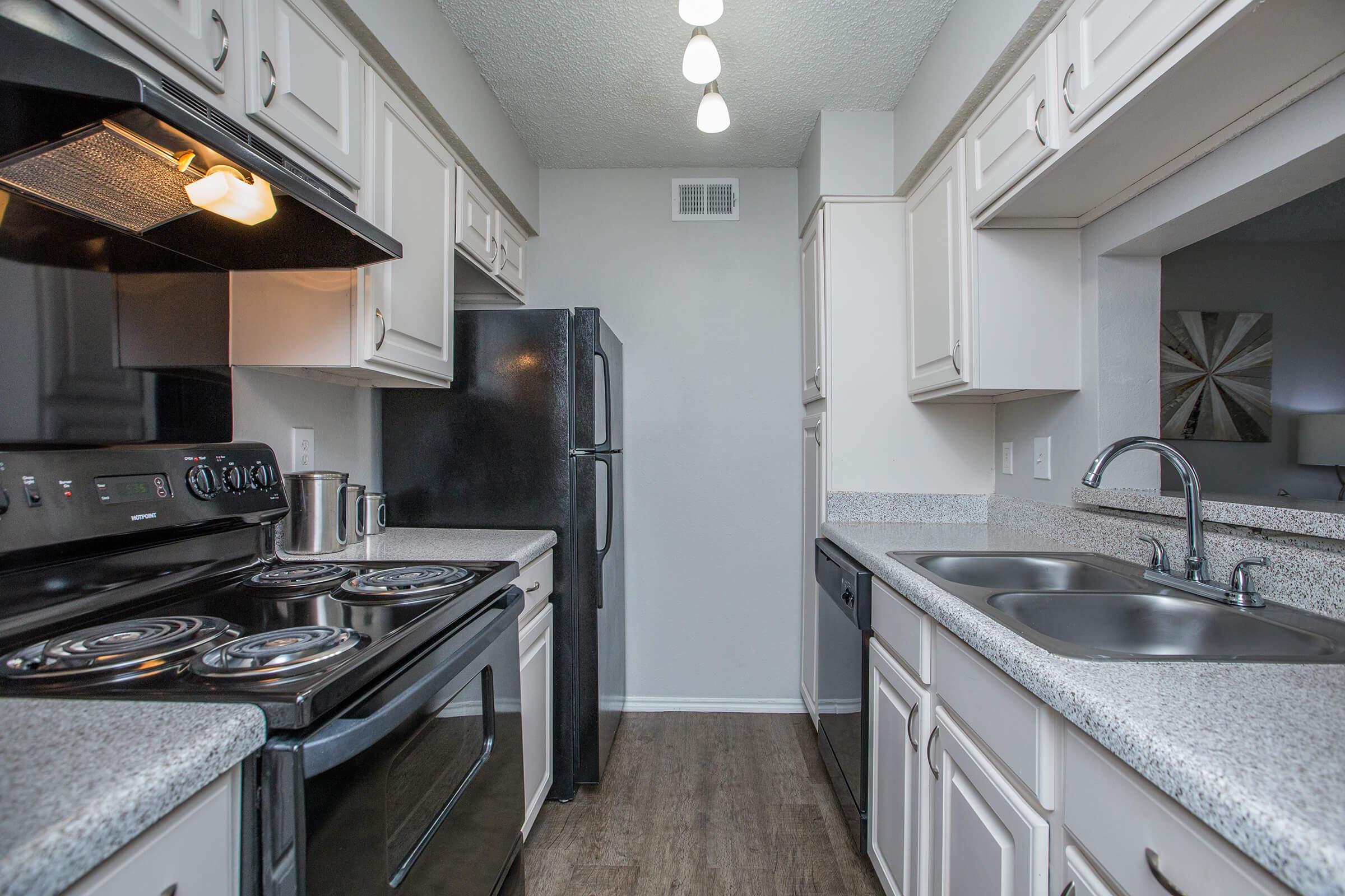 a large kitchen with stainless steel appliances